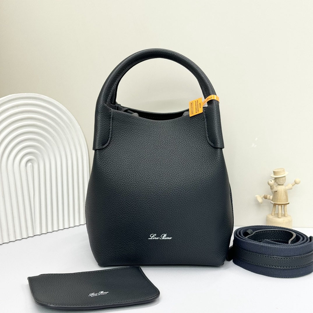 Loro piana Bale Medium Bucket Bag: We offer FREE SHIPPING for both domestic and international clients who bid over $500. The Loro Piana Bale Medium Bucket Bag in Navy Blue is crafted from premium calfskin leather with a suede lining. I