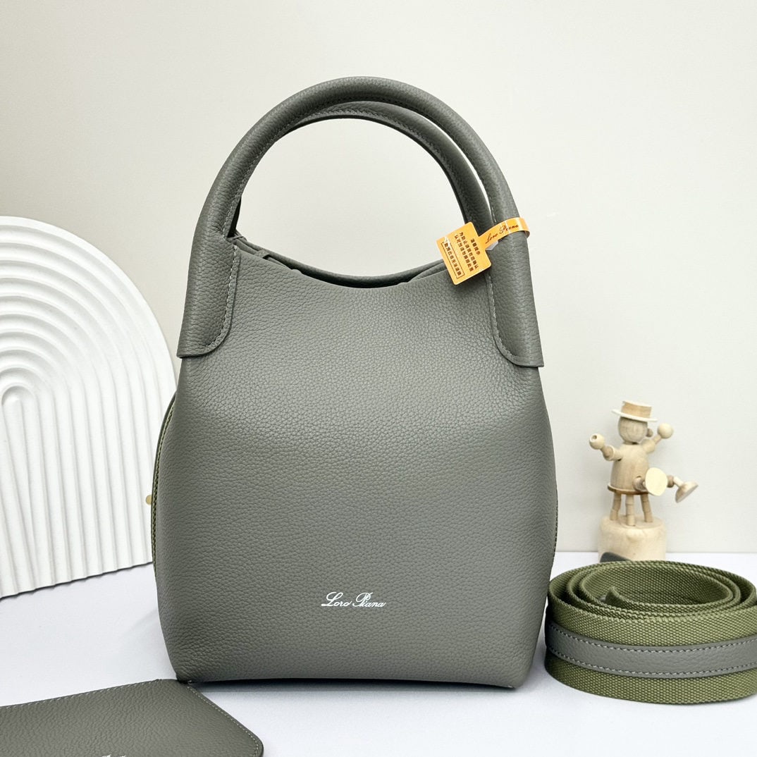 Loro piana Bale Medium Bucket Bag: We offer FREE SHIPPING for both domestic and international clients who bid over $500. The Loro Piana Bale Medium Bucket Bag in Mate Tea is crafted from premium calfskin leather with a suede lining. It
