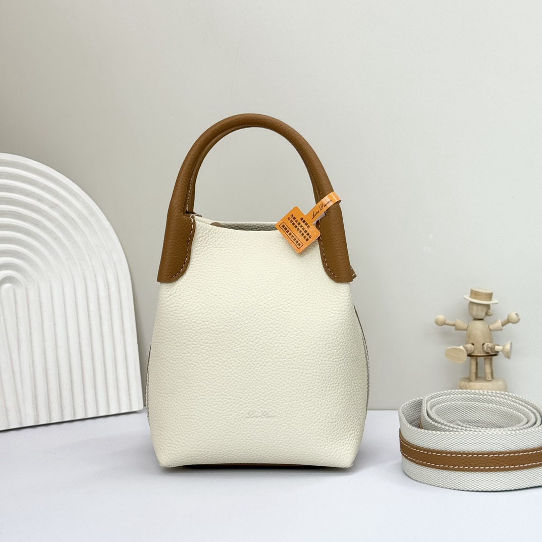 Loro piana Bale Mini Bucket Bag: We offer FREE SHIPPING for both domestic and international clients who bid over $500. The Loro piana Bale mini bucket bag, in white and brown, is crafted from signature Flower denim. It features hand-