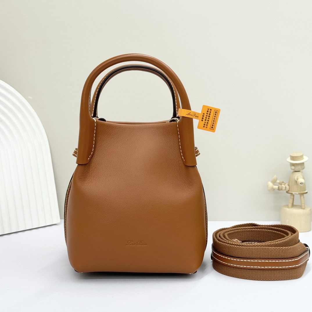 Loro piana Bale Mini Bucket Bag: We offer FREE SHIPPING for both domestic and international clients who bid over $500. The Loro piana Bale mini bucket bag is crafted in a warm tan from signature Flower denim. It features hand-stitche