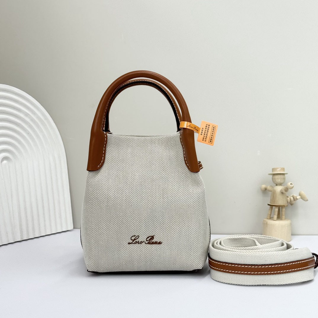Loro piana Bale Mini Bucket Bag: We offer FREE SHIPPING for both domestic and international clients who bid over $500. The Loro Piana Bale mini bucket bag in a warm linen brown is crafted from signature Flower denim. It features hand