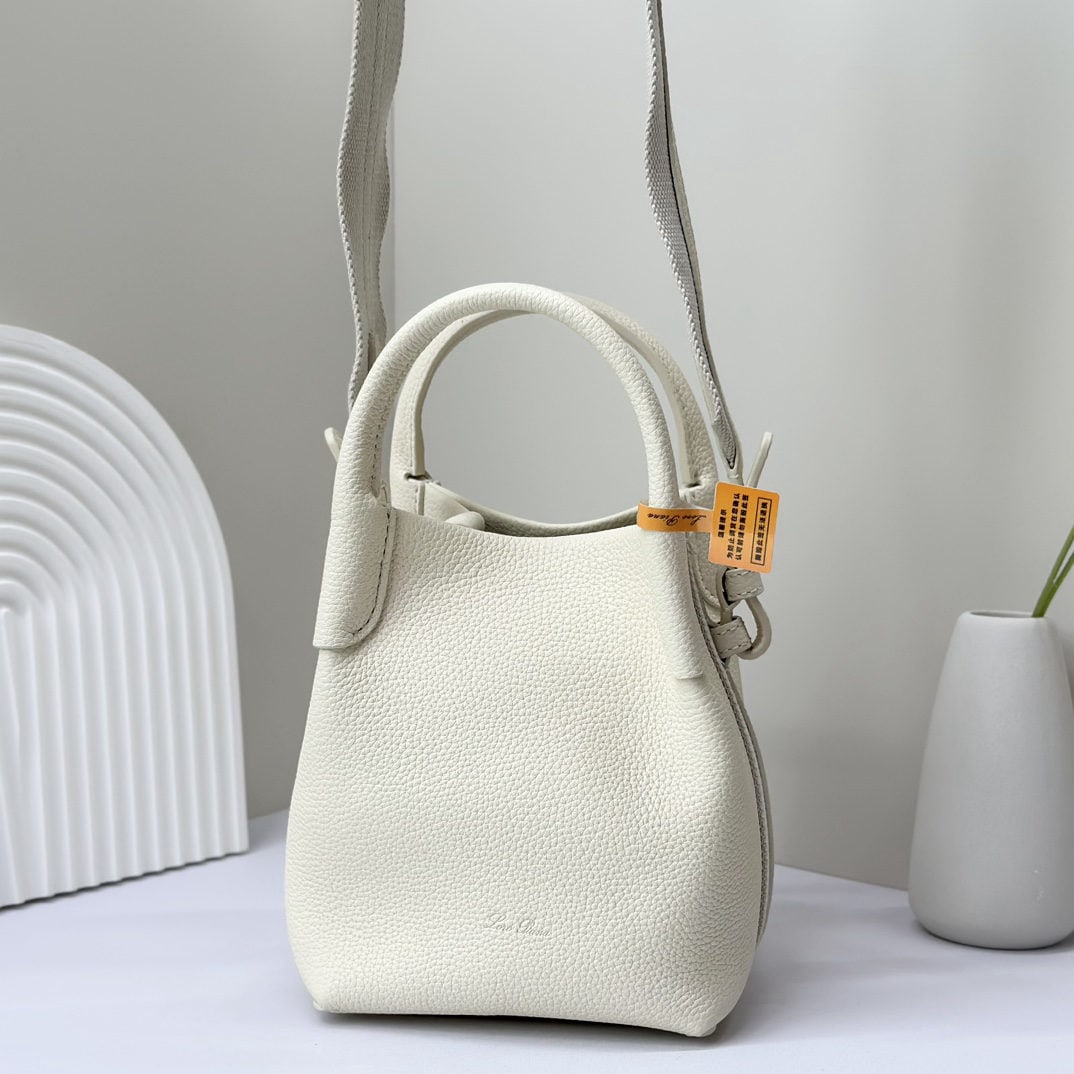 Loro piana Bale Mini Bucket Bag: We offer FREE SHIPPING for both domestic and international clients who bid over $500. The Loro piana Bale mini bucket bag in off-white is crafted from signature Flower denim. It features hand-stitched