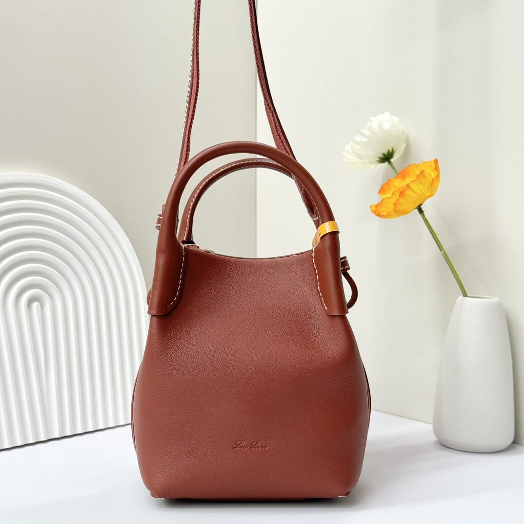 Loro piana Bale Mini Bucket Bag: We offer FREE SHIPPING for both domestic and international clients who bid over $500. The Loro Piana Bale mini bucket bag is crafted in deep red from signature Flower denim, featuring hand-stitched ha