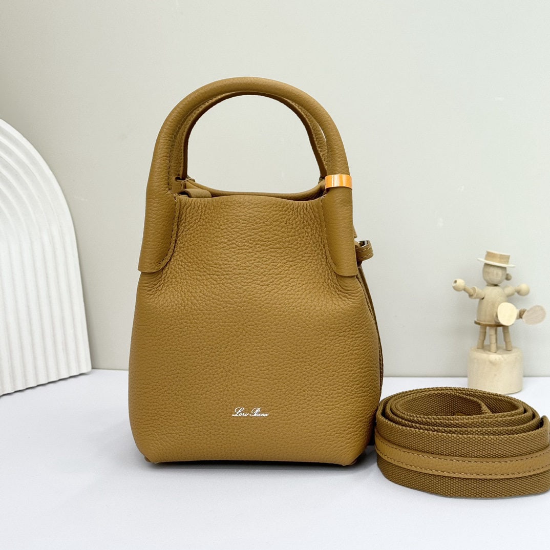 Loro piana Bale Mini Bucket Bag: We offer FREE SHIPPING for both domestic and international clients who bid over $500. The Loro piana Bale mini bucket bag, in ginger yellow, is crafted from signature Flower denim. It features hand-st