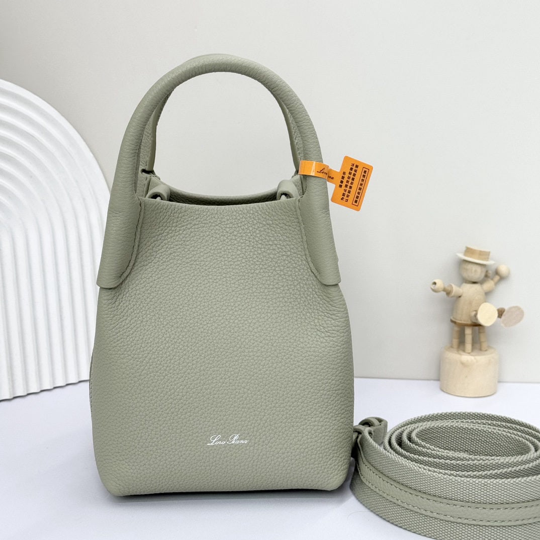 Loro piana Bale Mini Bucket Bag: We offer FREE SHIPPING for both domestic and international clients who bid over $500. The Loro Piana Bale mini bucket bag in mustard green is crafted from signature Flower denim, featuring hand-stitch