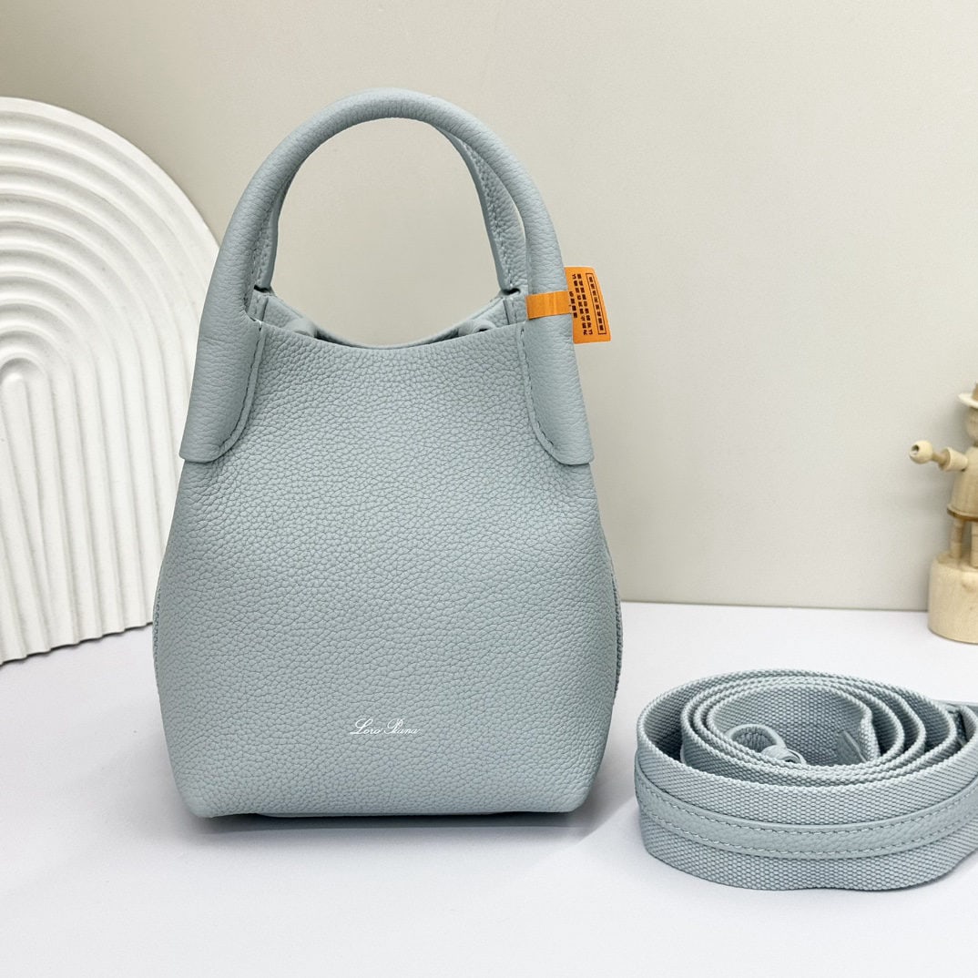 Loro piana Bale Mini Bucket Bag: We offer FREE SHIPPING for both domestic and international clients who bid over $500. The Loro Piana Bale mini bucket bag in light blue is crafted from signature Flower denim, featuring hand-stitched 