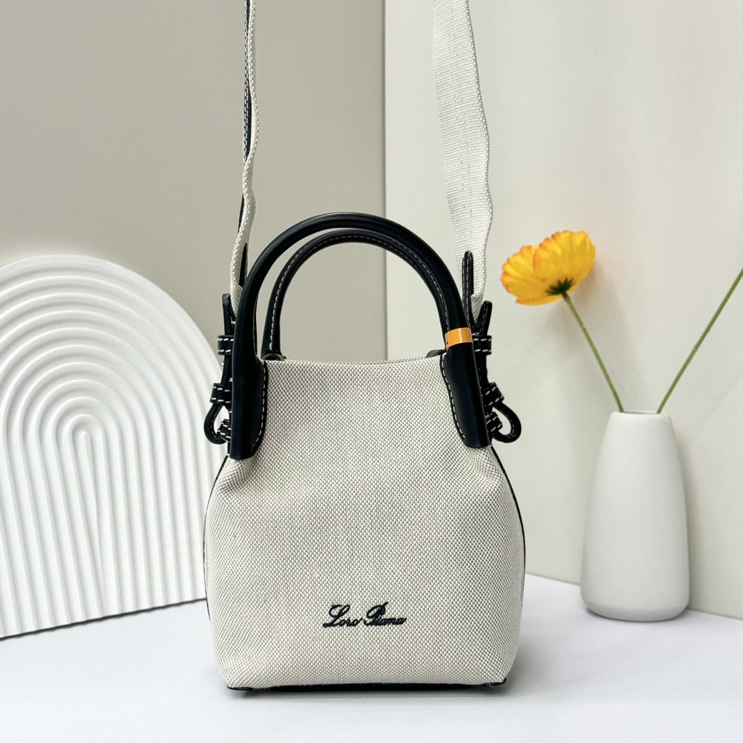 Loro piana Bale Mini Bucket Bag: We offer FREE SHIPPING for both domestic and international clients who bid over $500. The Loro Piana Bale mini bucket bag in deep linen blue is crafted from signature Flower denim. It features