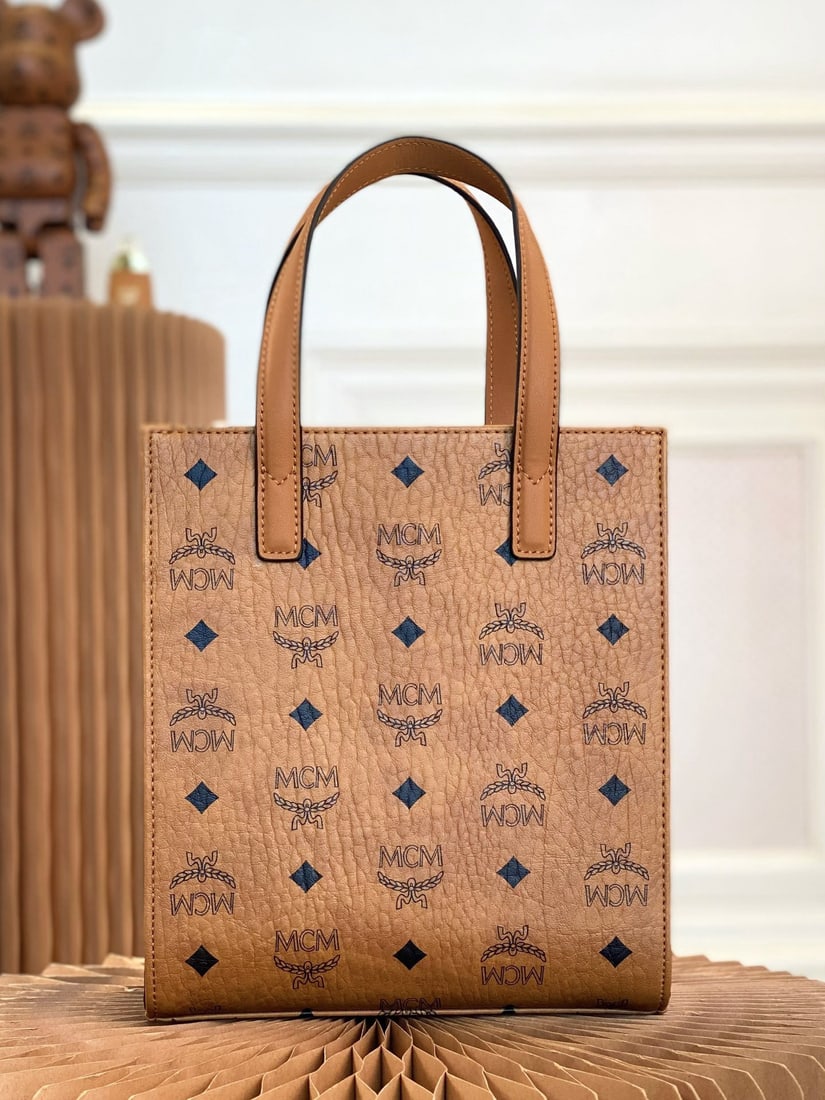 MCM handbag: We offer FREE SHIPPING for both domestic and international clients who bid over $500. This exquisite handbag is the essential bag for creating a stylish look. Crafted from classic Visetos and trimmed