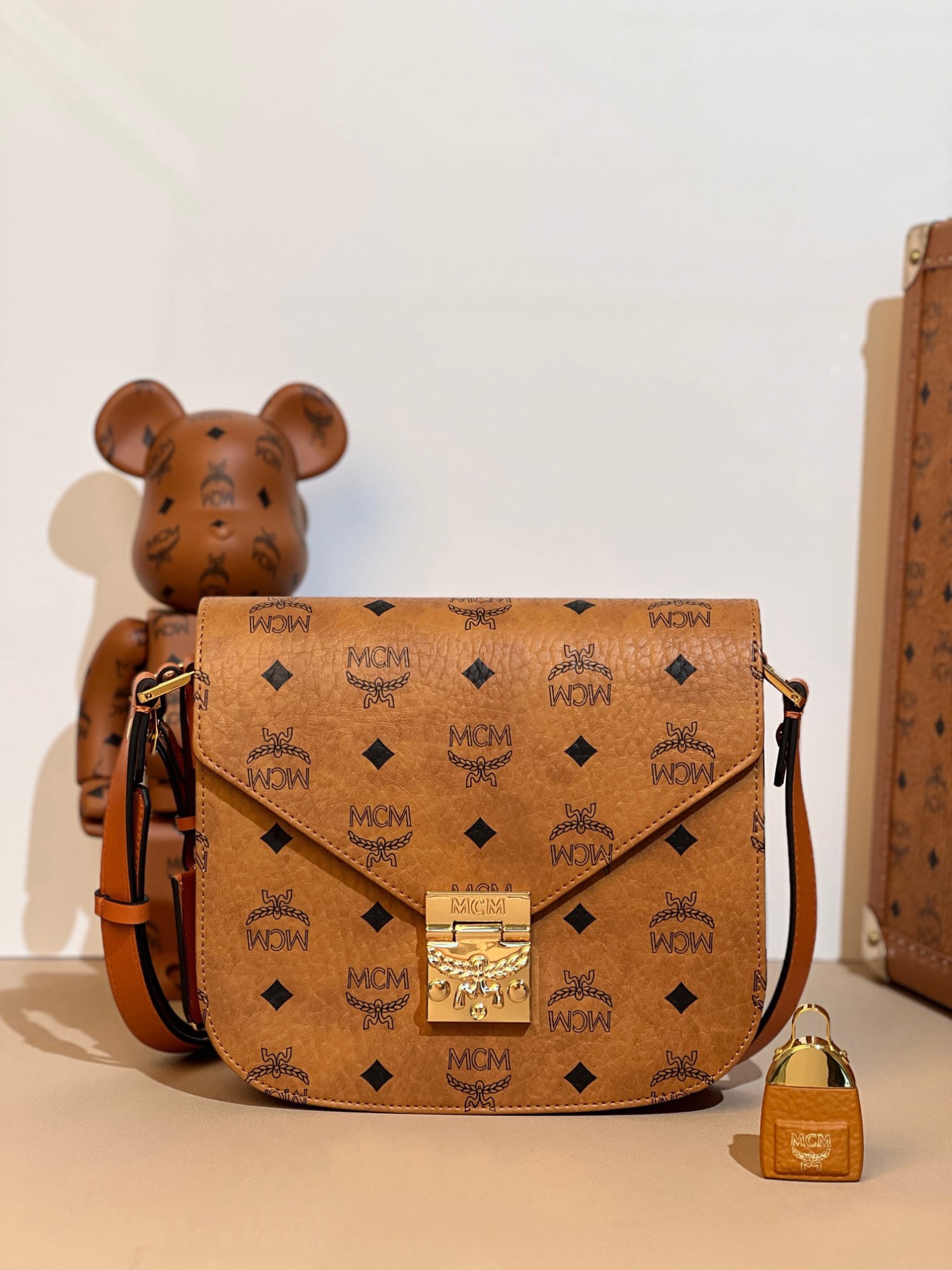 MCM Pasetia Visetos Saddle Bag: We offer FREE SHIPPING for both domestic and international clients who bid over $500. MCM Pasetia Visetos saddle bag, cognac-colored, single-shoulder/crossbody bag for women. Sufficient capacity, can 