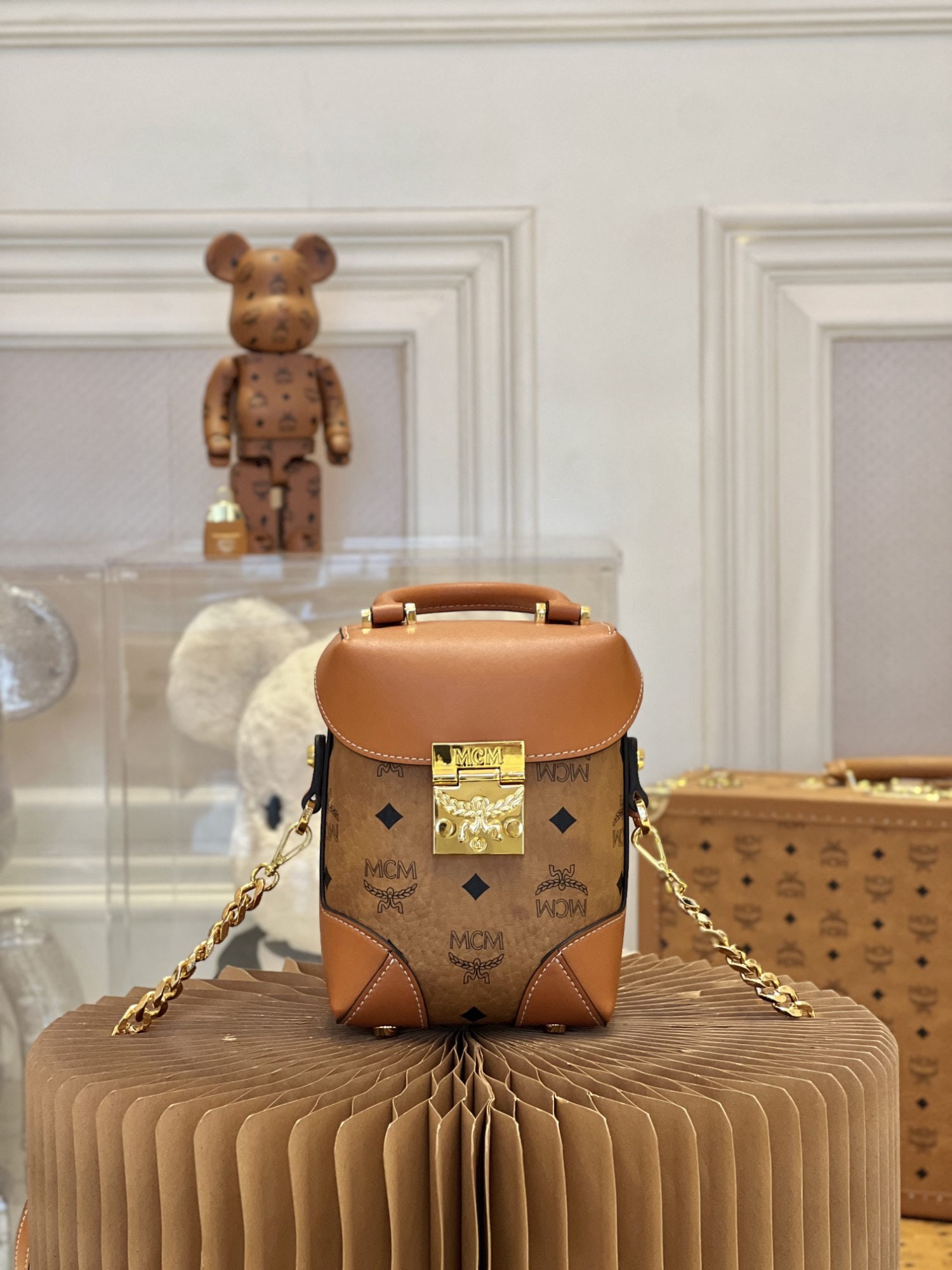 MCM Cognac Print Vertical Shoulder/Crossbody Bag: We offer FREE SHIPPING for both domestic and international clients who bid over $500. MCM Cognac-colored printed vertical shoulder/crossbody bag, with a generous capacity and large enough to enlarge
