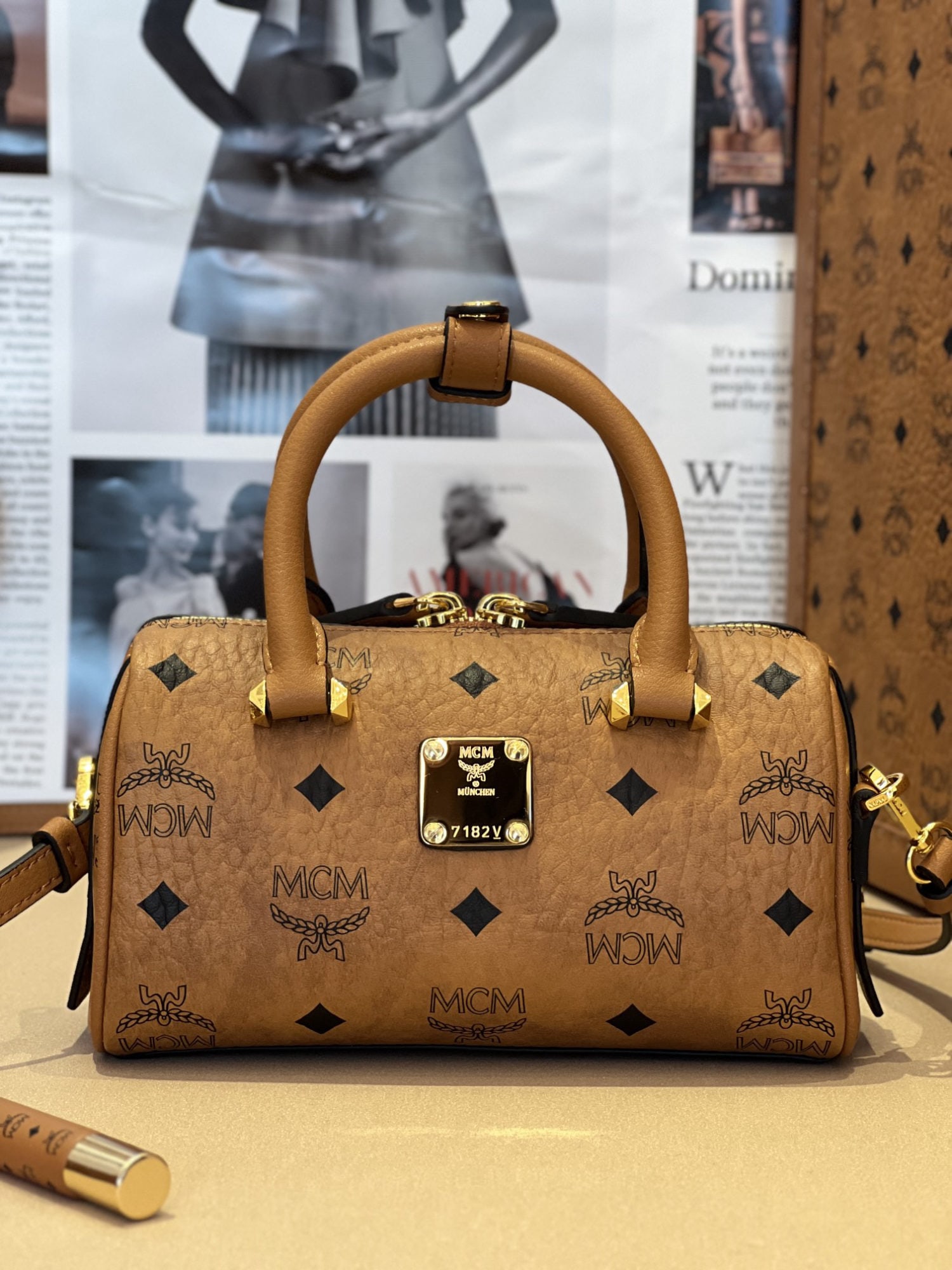 MCM Boston Handbag: We offer FREE SHIPPING for both domestic and international clients who bid over $500. This Boston-style tote bag is crafted from classic visetos material and features a travel bag-like design with