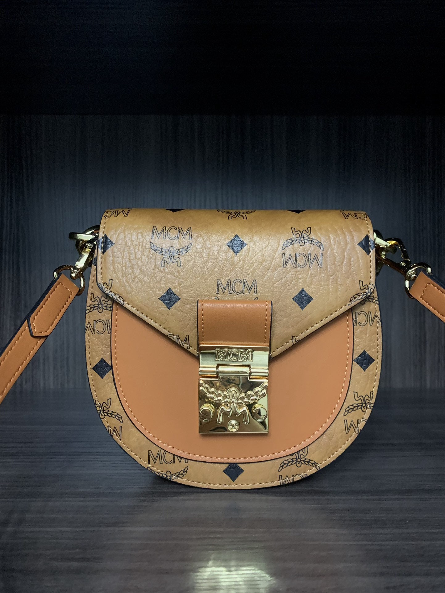 MCM bags: We offer FREE SHIPPING for both domestic and international clients who bid over $500. This shoulder bag draws inspiration from traditional saddlebags, featuring a playful, half-moon silhouette. A