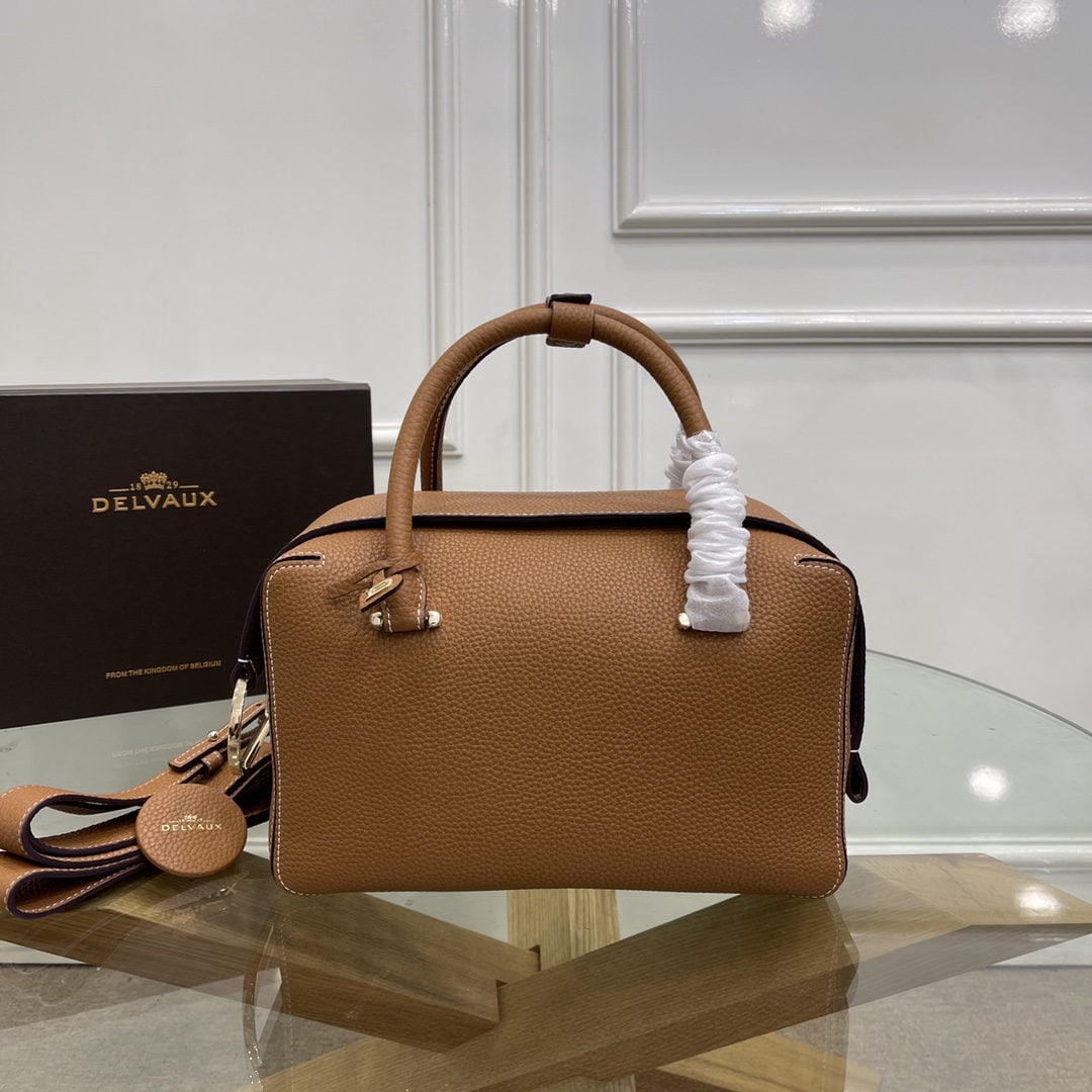 Delvaux: We offer FREE SHIPPING for both domestic and international clients who bid over $500. The most striking feature of the Delvau semi-handcrafted Cool Box is its unique D-shaped pull tab and cubic