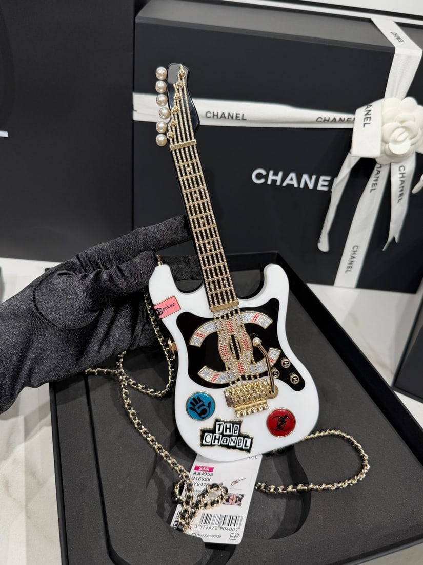 CHANEL Guitar Evening Box Bag: We offer FREE SHIPPING for both domestic and international clients who bid over $500. The KISSY guitar evening box is exquisitely crafted with intricate designs and various elements, giving it a luxur