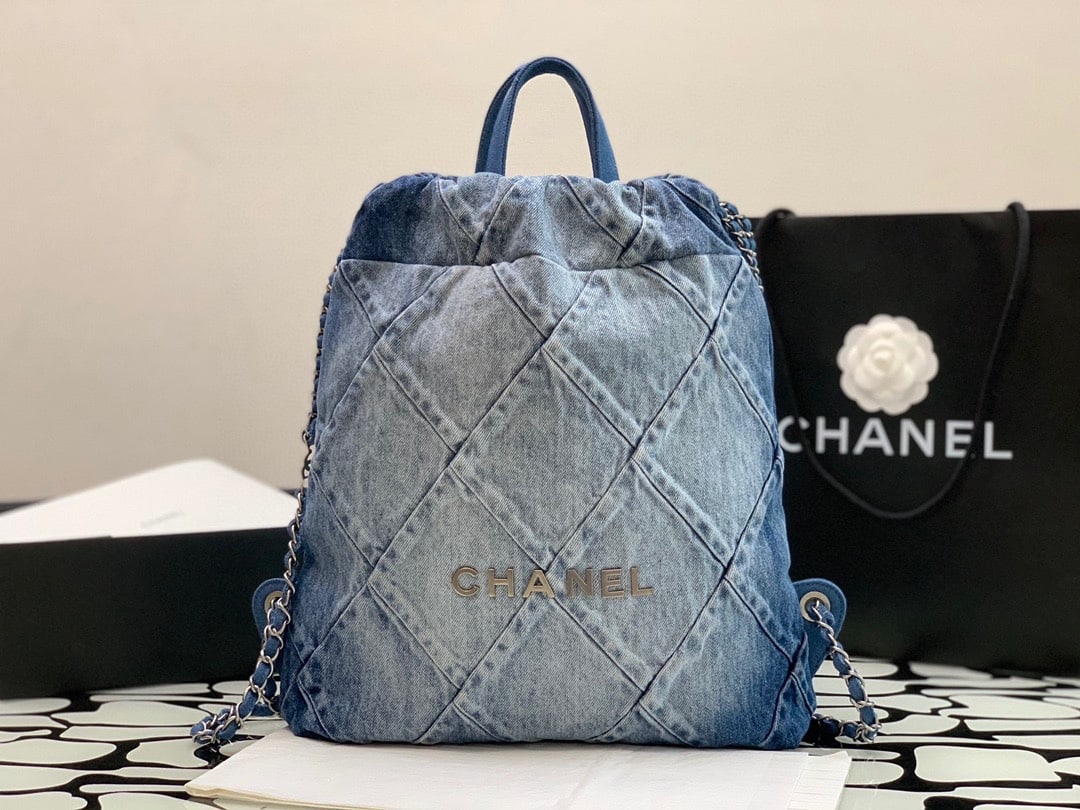 CHANEL Spring/Summer New Denim Backpack: We offer FREE SHIPPING for both domestic and international clients who bid over $500. This new spring/summer denim backpack is known for its casual and relaxed style. The silver hardware adds a youthf