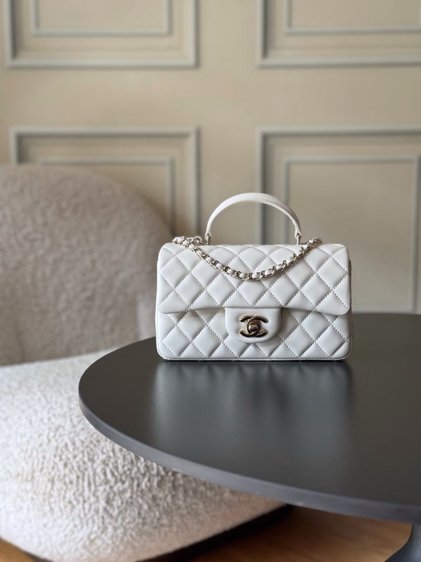 CHANEL's latest Mini CF handle handbag: We offer FREE SHIPPING for both domestic and international clients who bid over $500. CHANEL's latest Mini CF handle tote bag features a classic quilted flap closure and a delicate chain handle. Made 