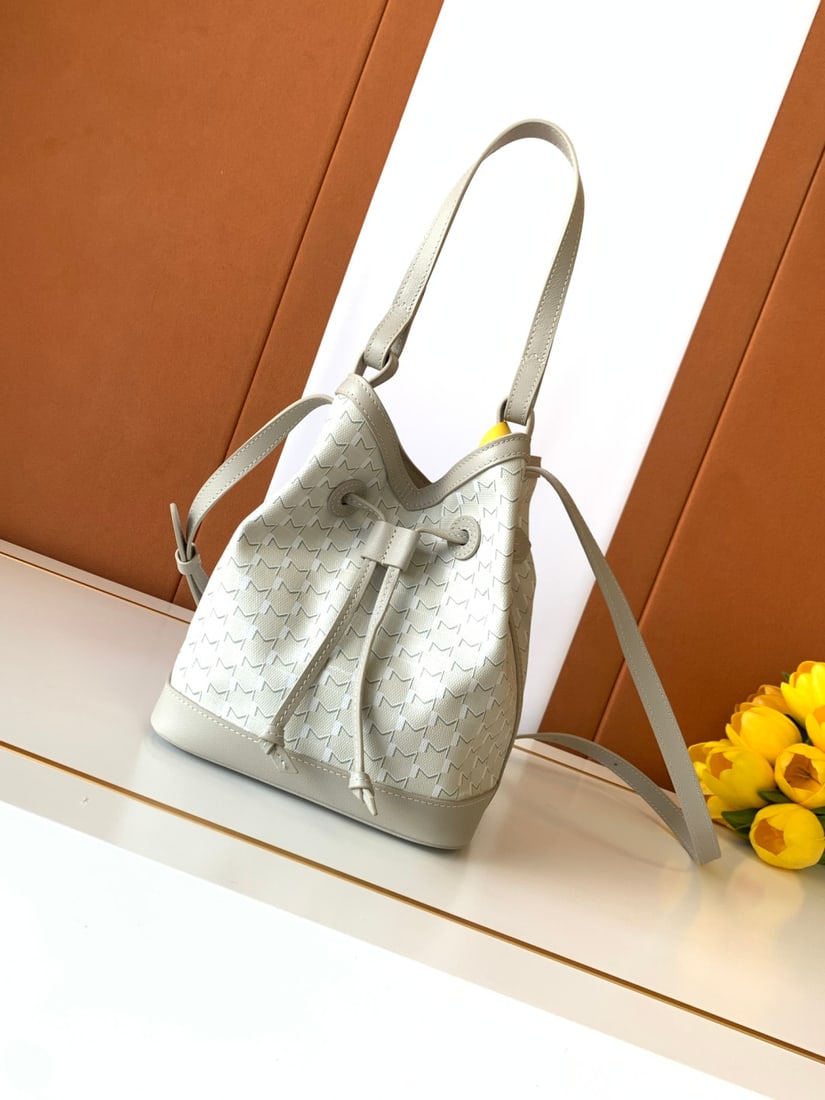 Moynat Canvas Bucket Bag: We offer FREE SHIPPING for both domestic and international clients who bid over $500. The Canvas series bucket bag is an urban and timeless creation. Moynat's "M" bucket bag highlights its casual styl