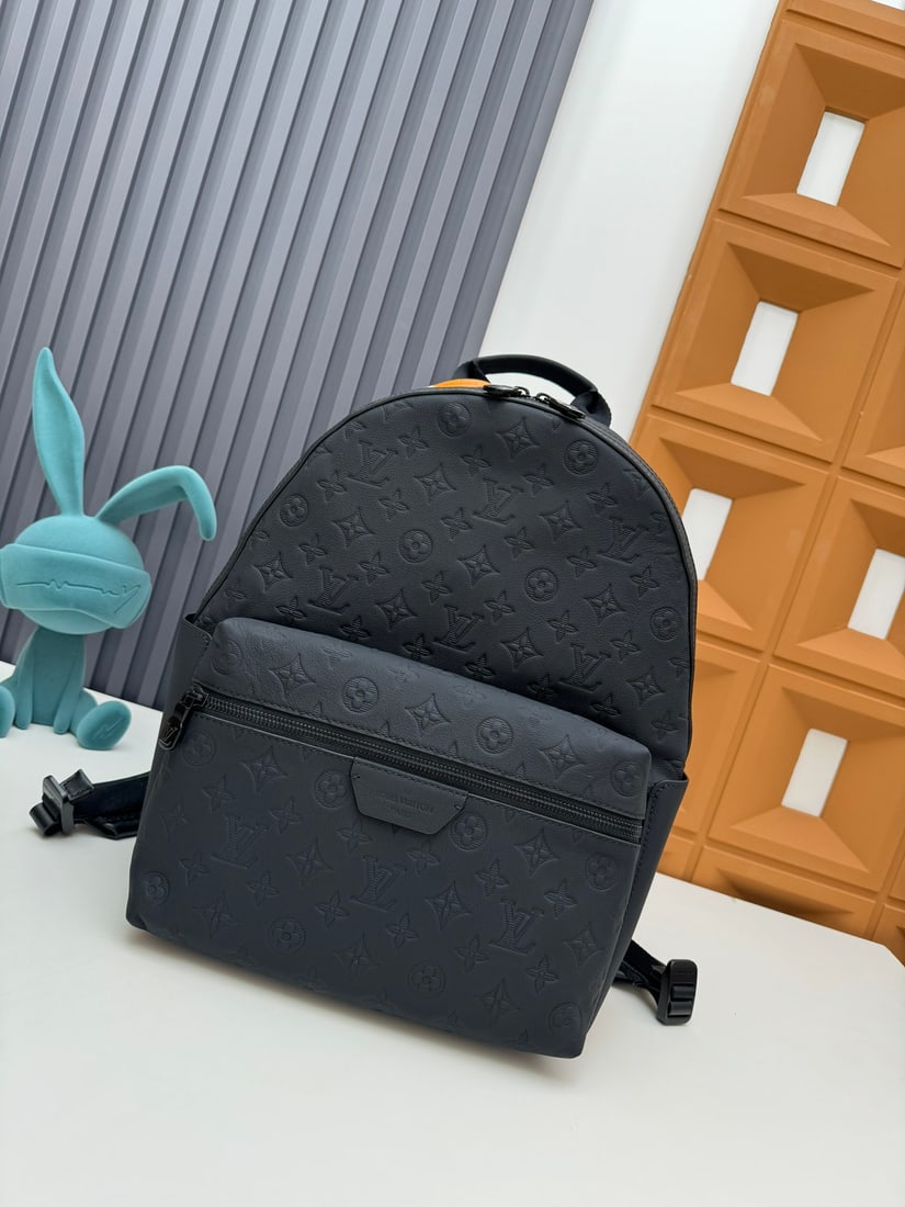 Discovery Backpack: We offer FREE SHIPPING for both domestic and international clients who bid over $500. This black-embossed Discovery backpack is crafted from Monogram Shadow leather, featuring embossed and printed LV 