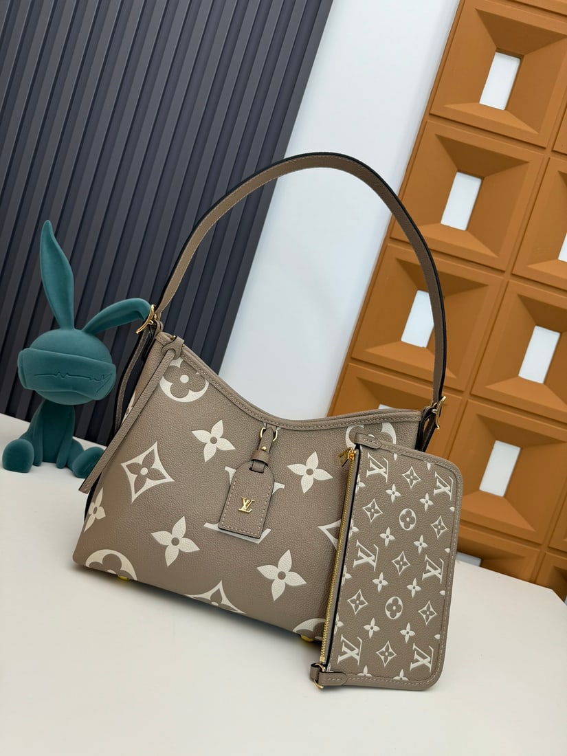 CarryAll Small Handbag: We offer FREE SHIPPING for both domestic and international clients who bid over $500. This CarryAll small handbag is crafted from Monogram Empreinte embossed leather, its soft texture conforming to th