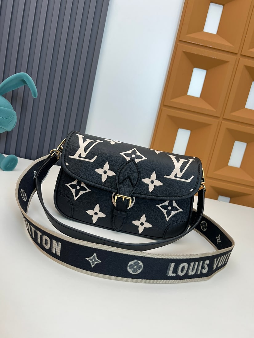 Diane handbags: We offer FREE SHIPPING for both domestic and international clients who bid over $500. This Diane handbag is crafted from Louis Vuitton's classic Monogram Empreinte embossed leather, featuring the bran