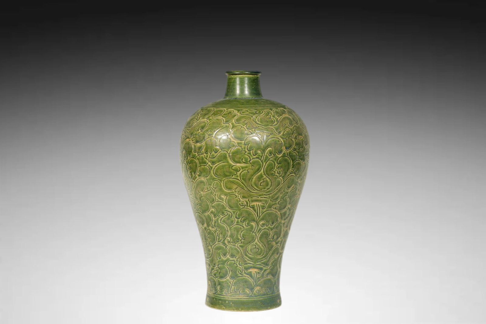 Ming Dynasty (Celadon) Carved Plum Vase (Meiping): An Important GREEN?GLAZED (Celadon) CARVED PLUM VASE (MEIPING)Ming Dynasty, 15th–16th CenturyHeight:36cmDescription: Gracefully potted in the classic meiping (plum vase) form, with a broad shoulder 