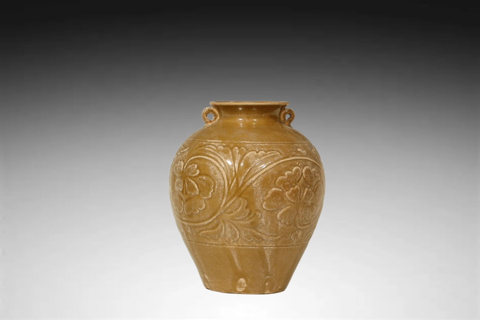 Ming Dynasty JIANG GLAZED CARVED JAR: An Outstanding JIANG GLAZED CARVED DOUBLE HANDLED “PO” (storage or wine) Jiang Dynasty, 15th–16th CenturyHeight:19.5cmDescription: Of robust ovoid form rising to a short neck with an everted