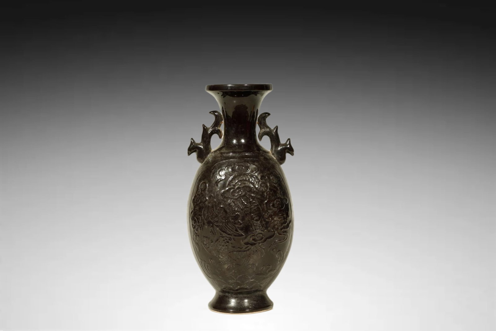 Song Dynasty Glazed Carved Double handled Vase: A CHOICE DARK PURPLE BROWN GLAZED CARVED DOUBLE HANDLED VASESong Dynasty, 12th–13th CenturyHeight:31cmDescription: Of elegant baluster form rising from a slightly splayed foot to a flared rim, this 