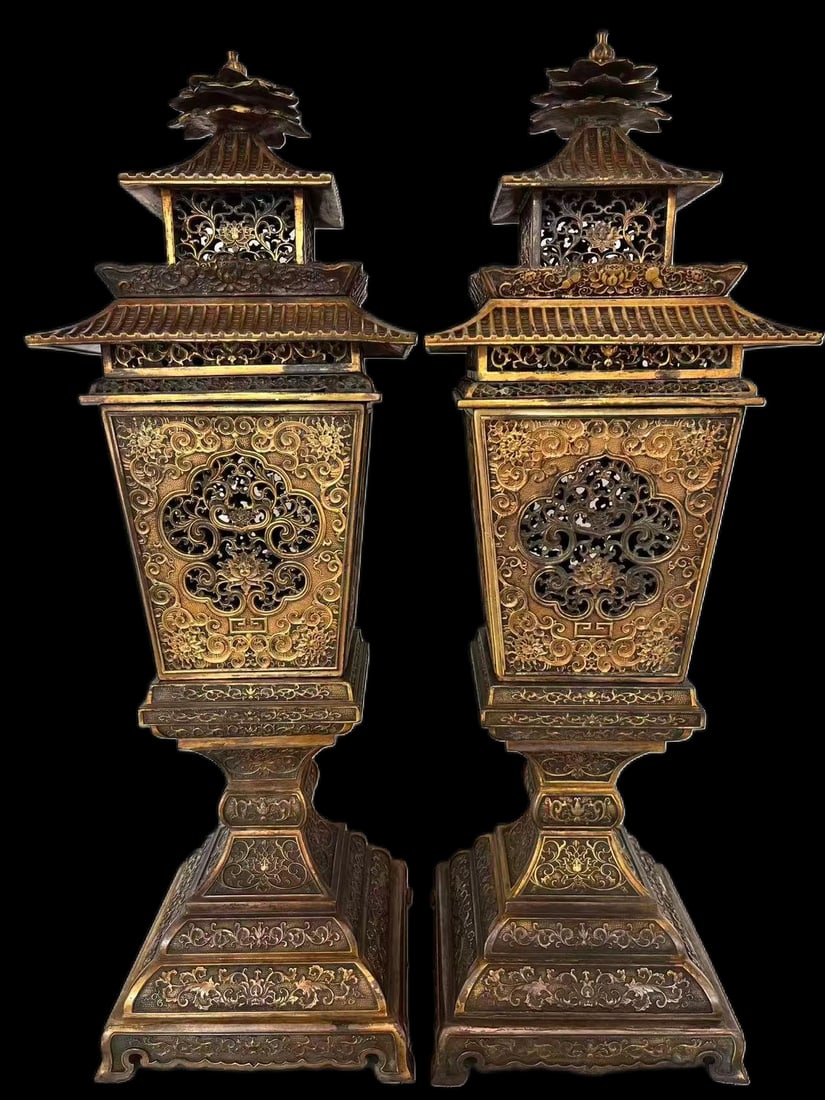 Ming Dynasty PAIR OF IMPERIAL GILT BRONZE CANDLESTICKS: AN IMPRESSIVE PAIR OF IMPERIAL GILT BRONZE OPEN-WORK CANDLESTICKS. Ming Dynasty, 15th–16th CenturyDimensions: 25.00"W x 77.00"H Description: Each candlestick is masterfully cast in the form of a mul