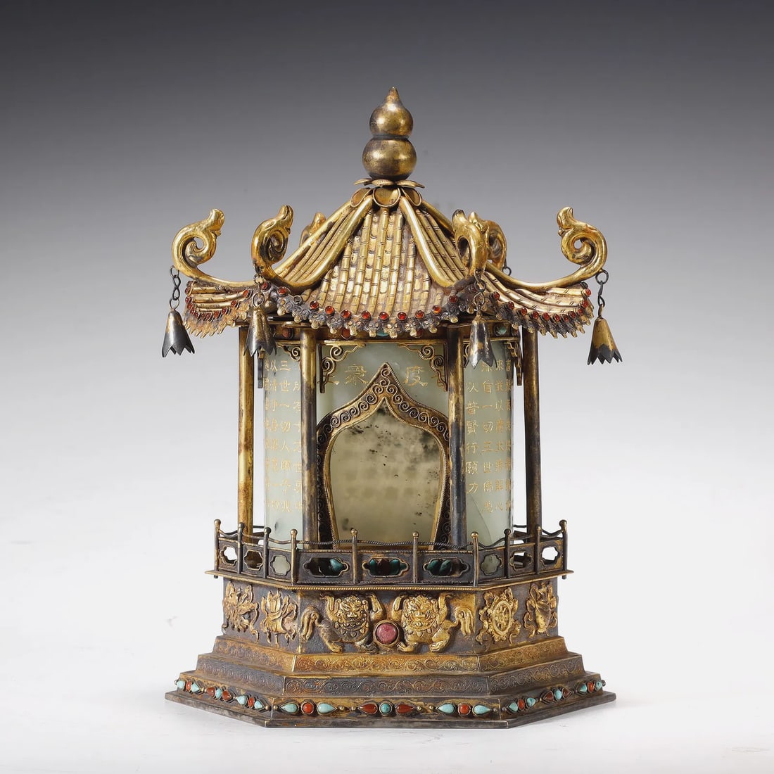 Qing Dynasty GILT BRONZE BUDDHA NICHE WITH HOTAN: A HANDSOME GILT BRONZE BUDDHA NICHE WITH HOTAN JADE PANELS AND CARNELIAN & TURQUOISE INLAYQing Dynasty, 18th CenturyHeight:22cm Width:14cmDescription: Superbly cast and richly gilded, this hexagonal B
