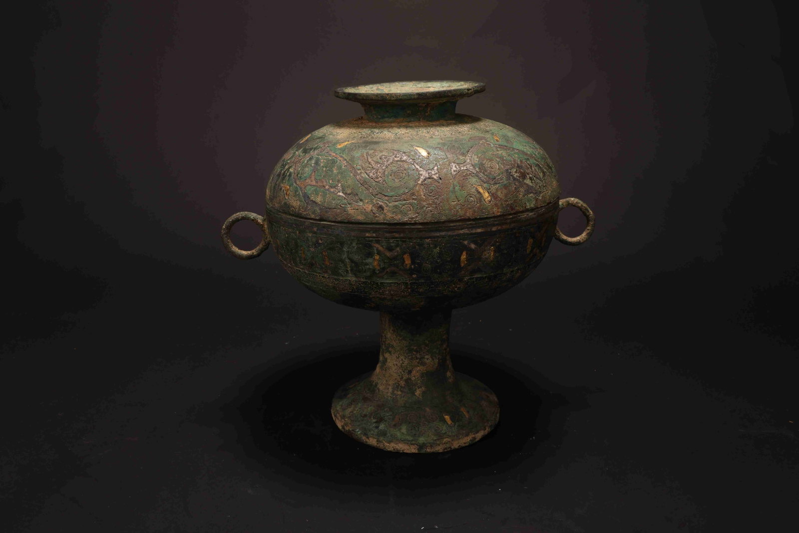 Warring States Gold-and-Silver-Inlaid Bronze Dou: Warring States Gold-and-Silver-Inlaid Bronze Dou (Ritual Stem Cup)Warring States Period, 475-221 BC Height: 18.5cm Weight: 2833g. Description: A covered bronze dou raised on a tall trumpet-form foot, 