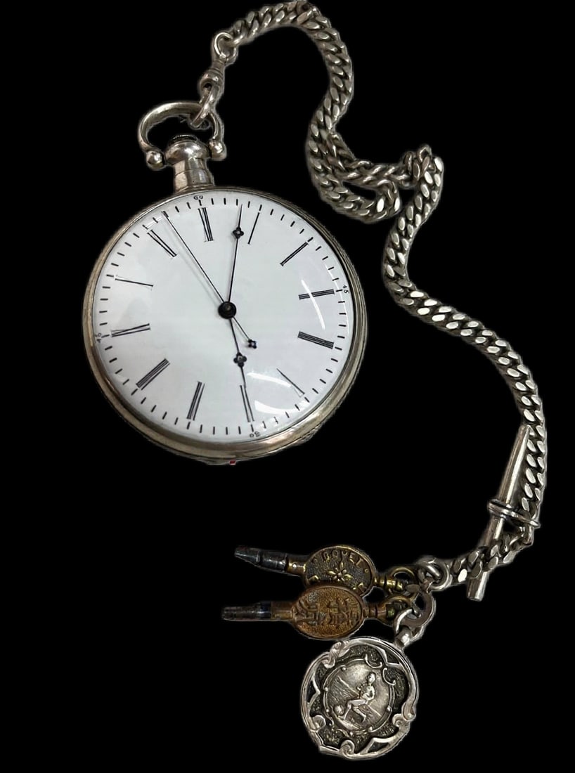 19th Century Swiss Silver-Cased Pocket Watch: AN ANTIQUE SILVER-CASED POCKET WATCH WITH 18K GOLD-SIGNED BALANCE COCK, ORNATE CHAMPLEVÉ ENAMEL MOVEMENT, ATTENDANT KEYS AND FOBSwitzerland, 19th CenturyHeight (case diameter): 6.2 cmDescription: An 
