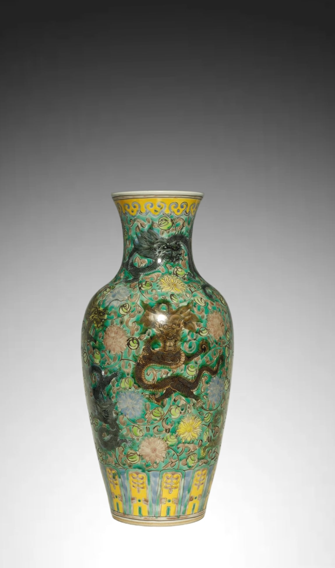 Qing Dynasty Rare Famille Verte Nine-dragon Vase: A MAGNIFICENT AND RARE FAMILLE VERTE NINE-DRAGON VASE. Qing Dynasty, Kangxi Period (1662–1722)Height:42.5cm. Description: Of exceptional chromatic brilliance, this imposing baluster vase (guanyinpin