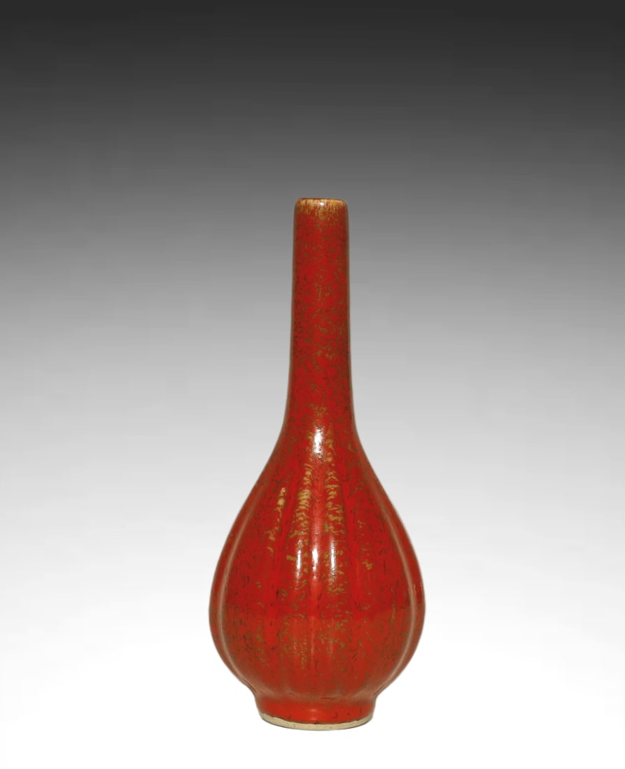 Qing Dynasty EXCEPTIONAL AND RARE IMPERIAL RED LOBED BOTTLE: AN EXCEPTIONAL AND RARE IMPERIAL RED-GLAZED GOLD-SPLASHED LOBED BOTTLE VASE Qing Dynasty, Kangxi Period (1662–1722)Height:24.5cm Description: Bearing a four-character Kangxi Yuzhi ('Imperially Made 