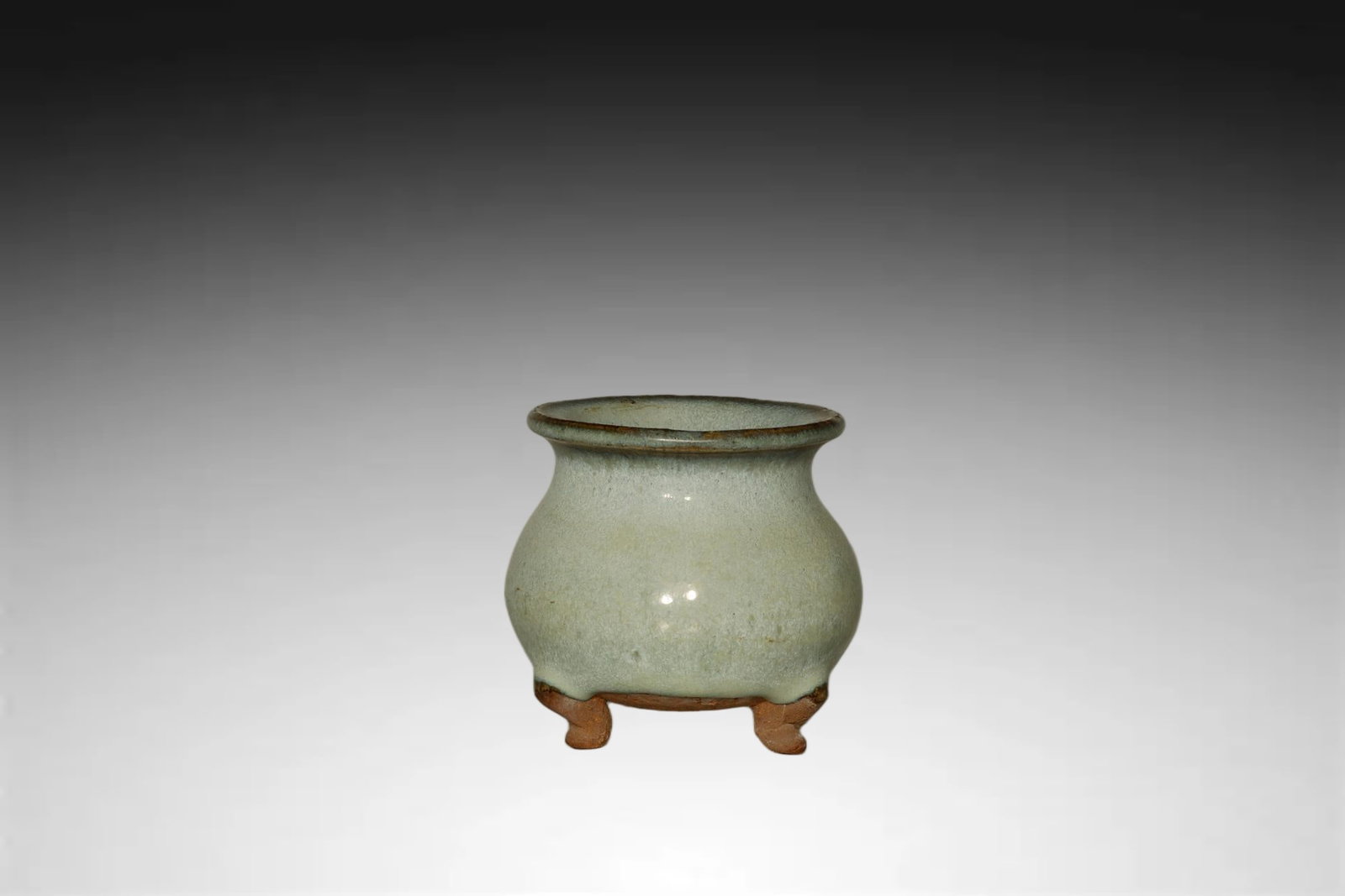 Song Dynasty Jun Kiln Tripod Incense Burner: A FINE JUN KILN TRIPOD INCENSE BURNERSong Dynasty (960–1279)Height:5cm Caliber 5cm.Description: Of elegant globular form, this finely potted Jun ware incense burner rests on three short, evenly spac