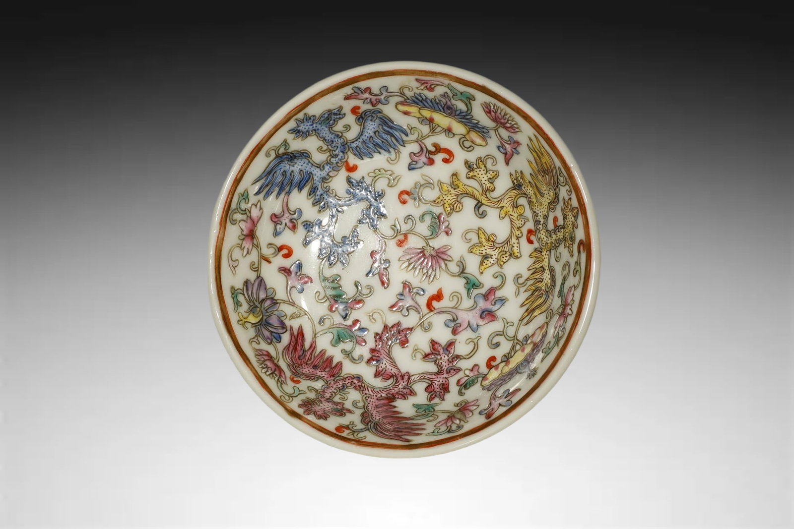 Qing Dynasty MAGNIFICENT FAMILLE?ROSE ‘PHOENIX: A MAGNIFICENT FAMILLE?ROSE ‘PHOENIX AND FLORAL’ PORCELAIN DISHQing Dynasty, Jiaqing Period (1796–1820)Diameter 7cmDescription: Porcelain with overglaze famille?rose enamels.Finely potted with sh