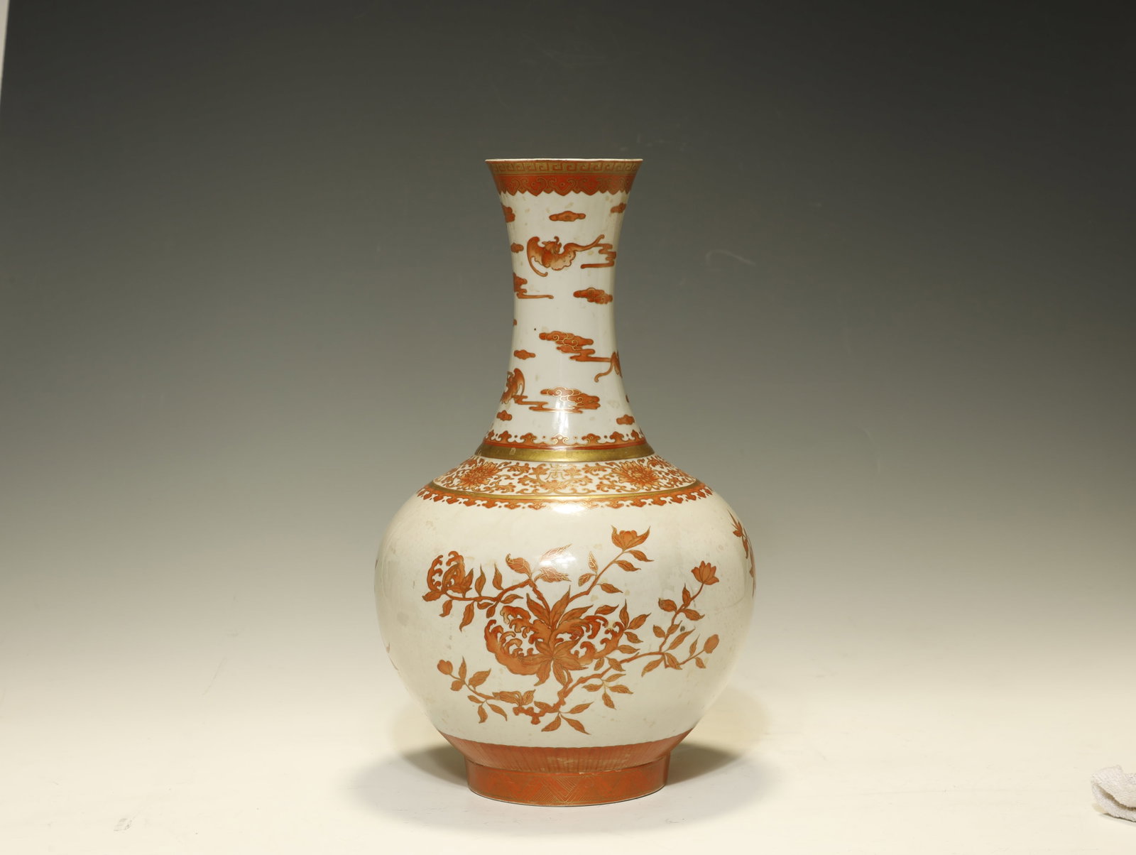 Qing Dynasty Fine Iron-Red and Gilt-Decorated: A Fine Iron-Red and Gilt-Decorated Bottle Vase, Xianfeng MarkChinese, Qing DynastyHeight 39 cmDescription: A porcelain bottle vase of globular body rising to a tall, gently trumpet-flared neck, the mo