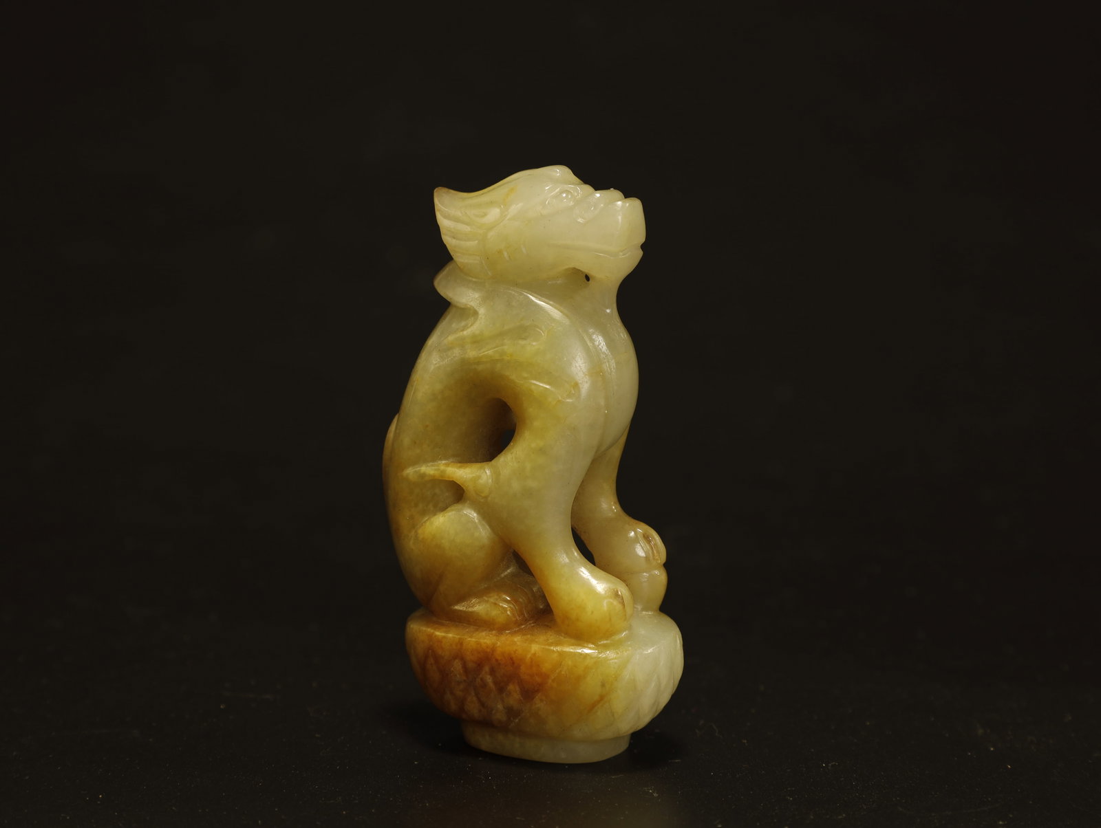 Tang Dynasty Hetian Jade Dragon Sculpture: An Exceptional Hetian Jade Dragon SculptureChinese, Tang DynastyHeight 7.2 cm × Length 4 cm × Width 2 cmDescription: Finely carved from translucent Hetian jade of warm honey?amber tone, this small s