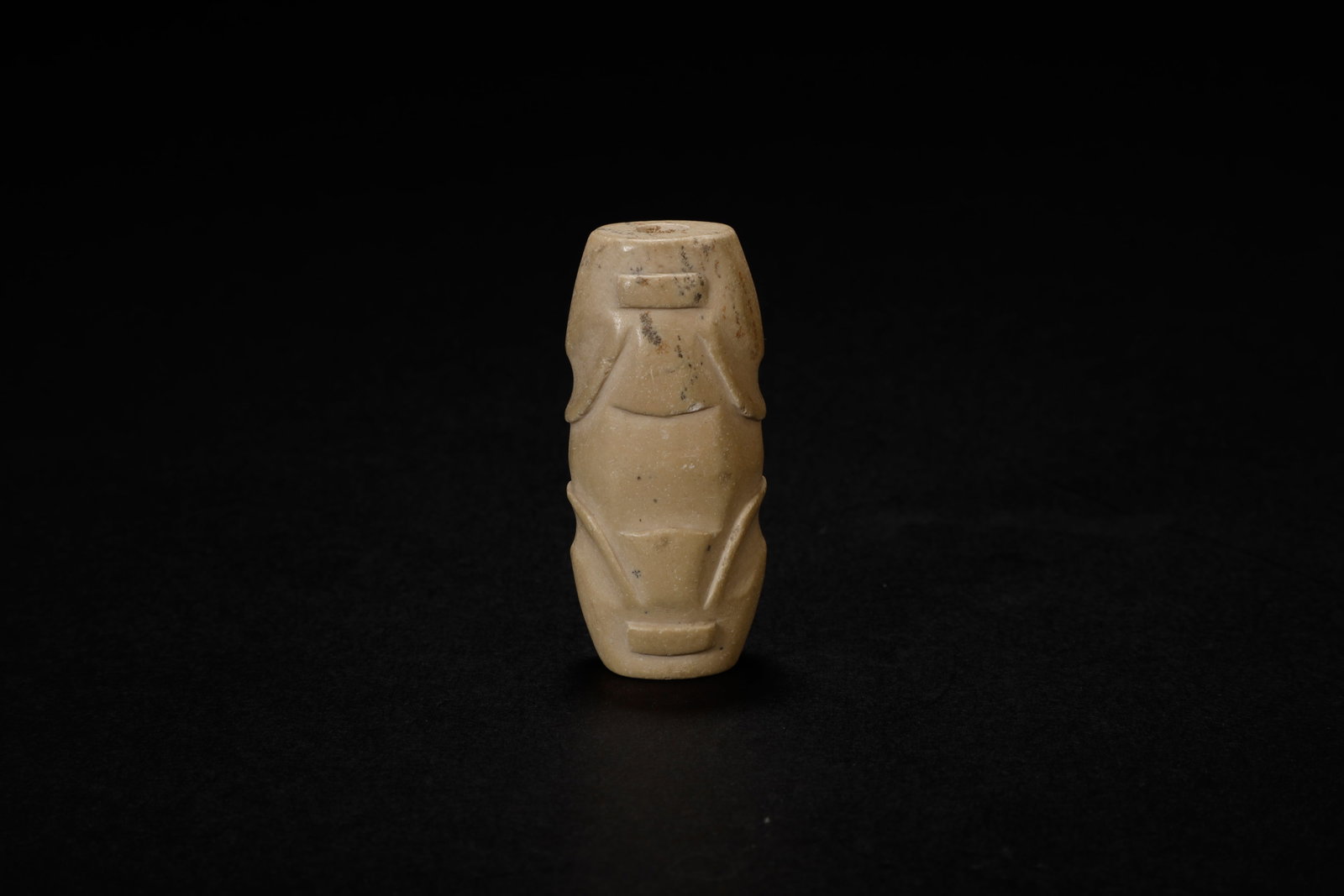 Han Dynasty Yellow Jade Lezi Pendant: A Superlative Han Dynasty Yellow Jade Lezi PendantChinese, Han Dynasty (206?BCE?–?220?CE)Length 4.8 cm × Diameter 2.2 cmDescription: Carved from yellow jade with a soft polish and traces of calcifi