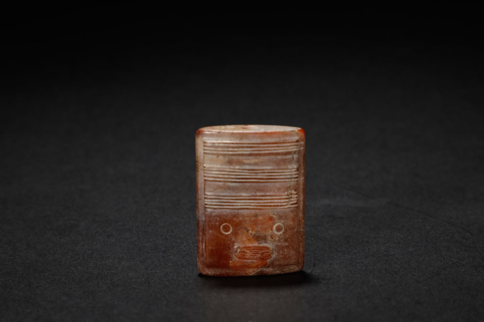 Han Dynasty Spiral?Pattern Jade Lezi Pendant: An Impressive Han Dynasty Spiral?Pattern Jade Lezi PendantChinese, Han Dynasty (206?BCE?–?220?CE)Length 4 cm × Diameter 3 cmDescription: Carved from russet?toned jade with areas of calcification an
