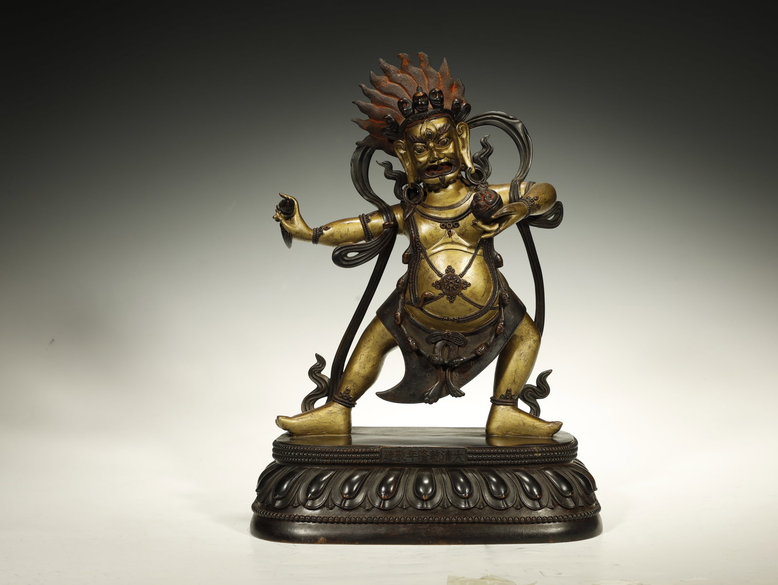 Qing Dynasty Gilt-Bronze Buddhist Figure of Vajrapani, Qianlong Mark and Period: A Fine Gilt-Bronze Figure of Vajrapani, Qianlong Mark and Period. Chinese/Tibet, Qing Dynasty. Height 36 cm × Base Length 26 cm × Base Width 18 cm. Description: A parcel-gilt bronze figure of Vajrap