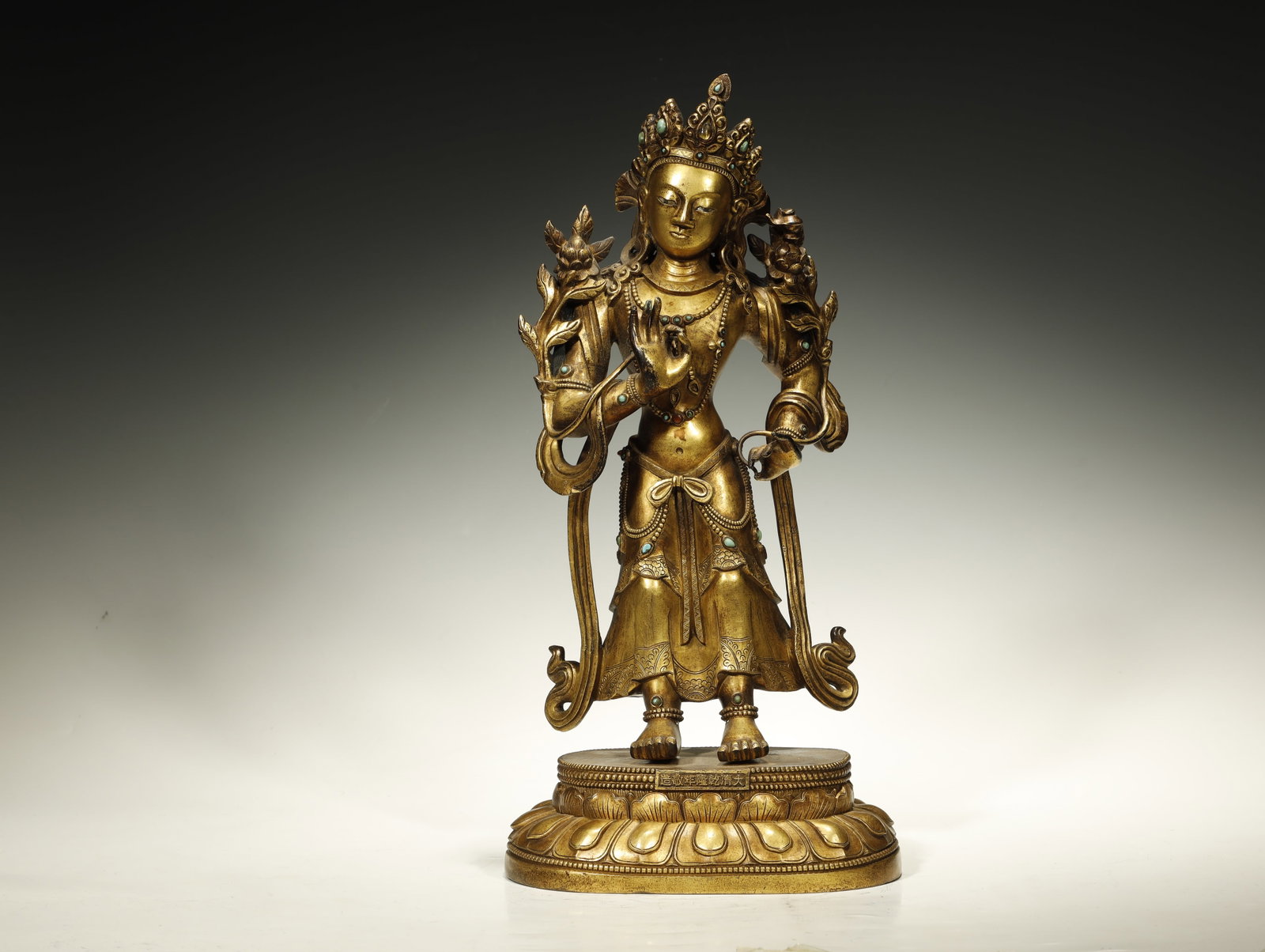 Qing Dynasty Gilt-Bronze Figure of bodhisattva: A Gilt-Bronze Figure of TaraChina, Qing DynastyHeight: 16.3 in. (41.5 cm); base 7.9 x 5.1 in. (20 x 13 cm)Description: A gilt-bronze figure of the bodhisattva Tara, seated in lalitasana (posture of ro