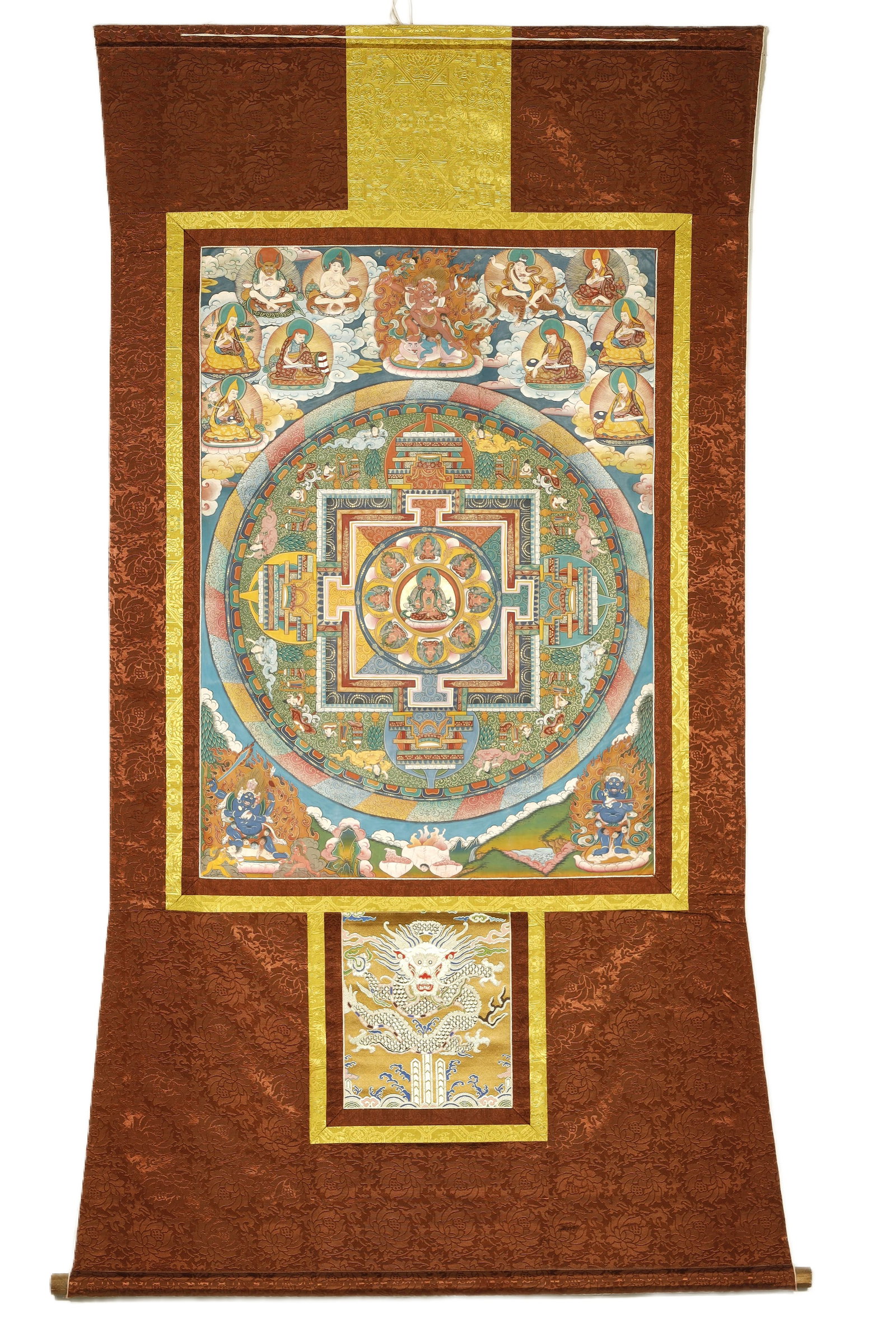 Qing Dynasty Thangka Mandala: A Painted Thangka MandalaChina/Tibet, Qing Dynasty34.6 x 25 in. (88 x 63.5 cm)Description: A hand-painted thangka depicting a mandala, its concentric palace architecture rendered in plan view within a
