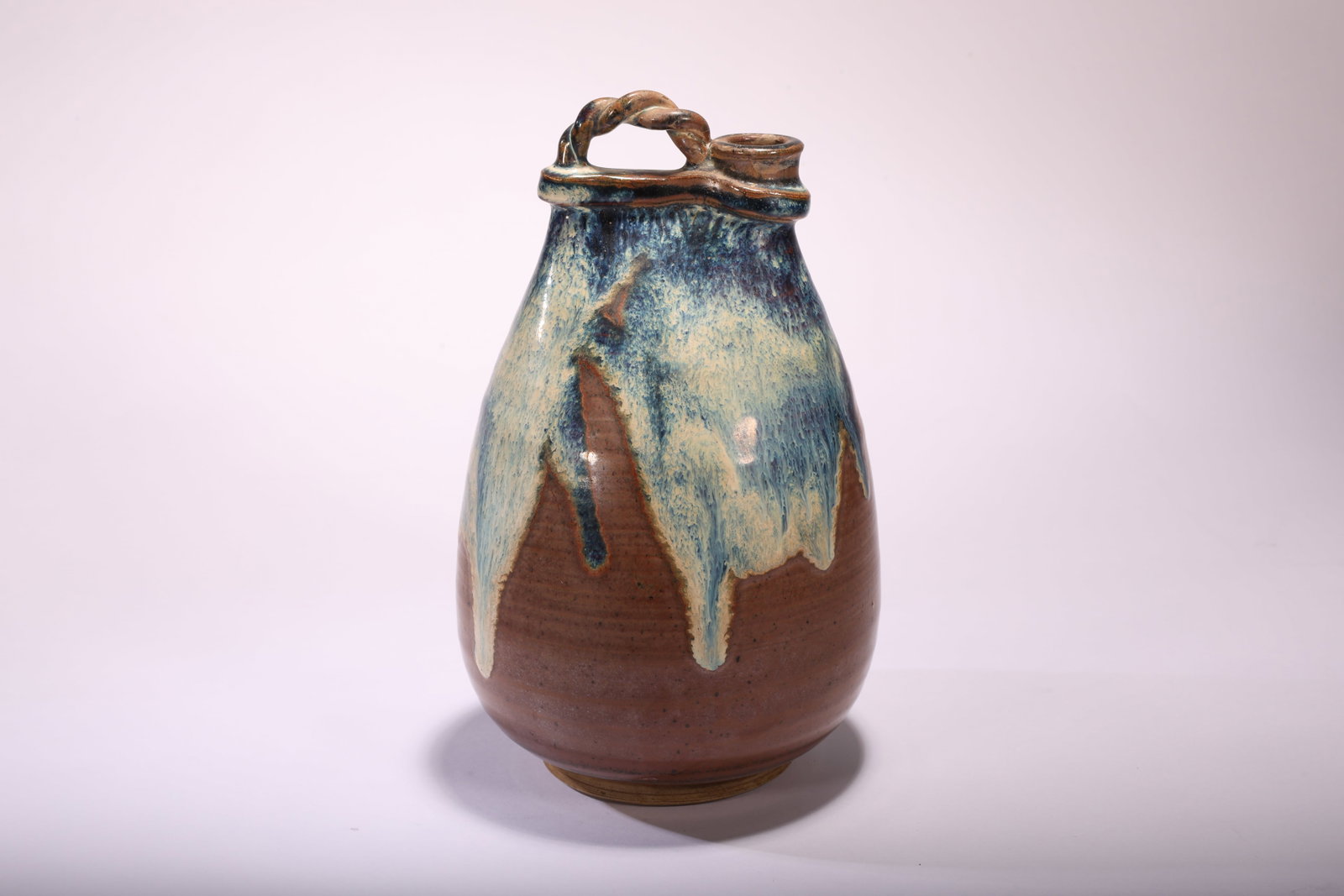 Song Dynasty Jun Ware Splashed Vase with Loop Handle: Song Dynasty Jun Ware Vase with Loop HandleSong Dynasty StyleHeight: 20cm Base / Foot: 7.5cmDescription: A stoneware vase of pear-shaped body rising to a short, cylindrical spout beside a twisted rope