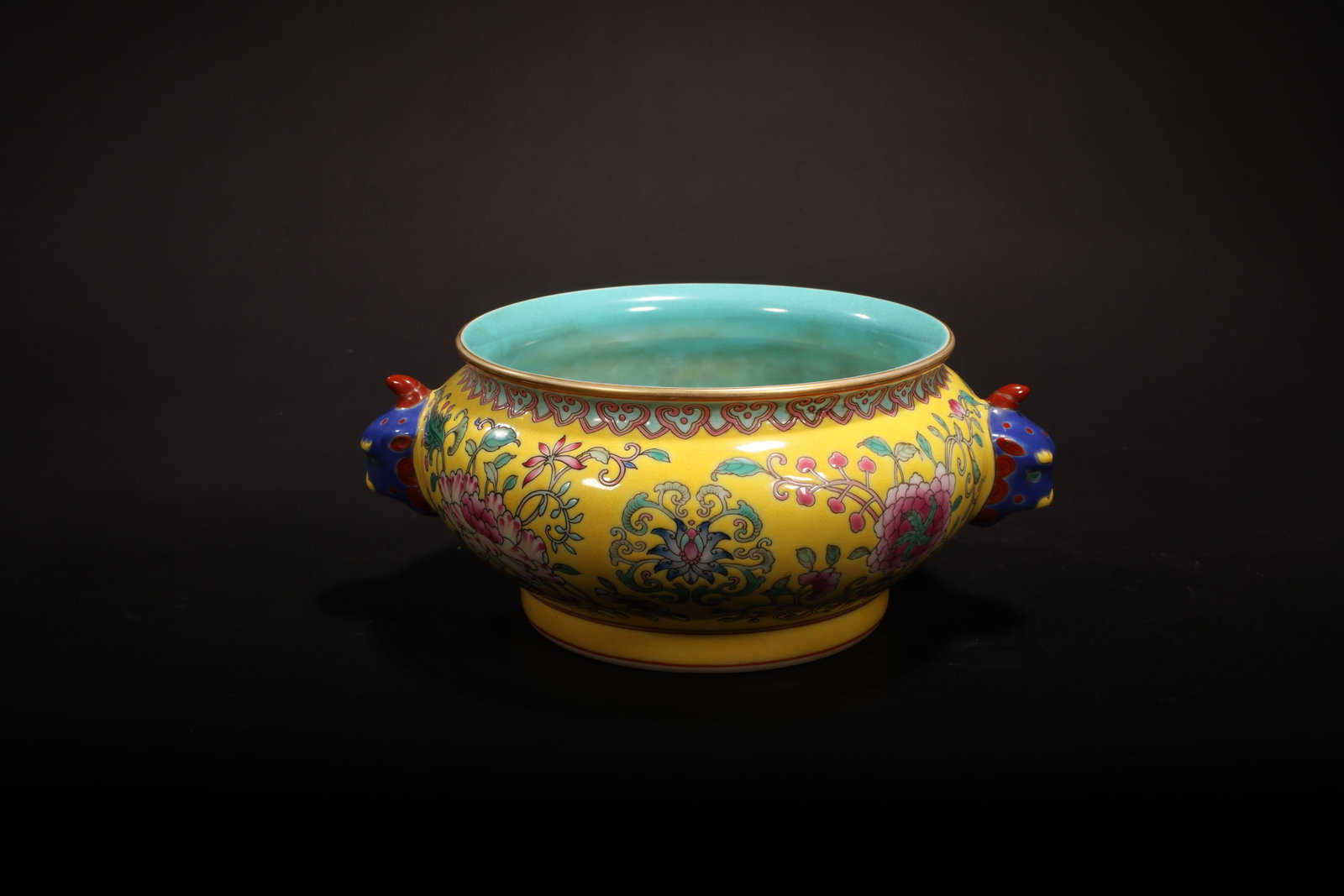 Qing Yongzheng Yellow-Ground Scrolling Floral Twin-Beast-Handle Censer: Qing Yongzheng Yellow-Ground Scrolling Floral Twin-Beast-Handle CenserQing Dynasty, Yongzheng StyleHeight: 8.5cm Diameter: 14cmDescription: A porcelain censer of compressed globular form, the exterior