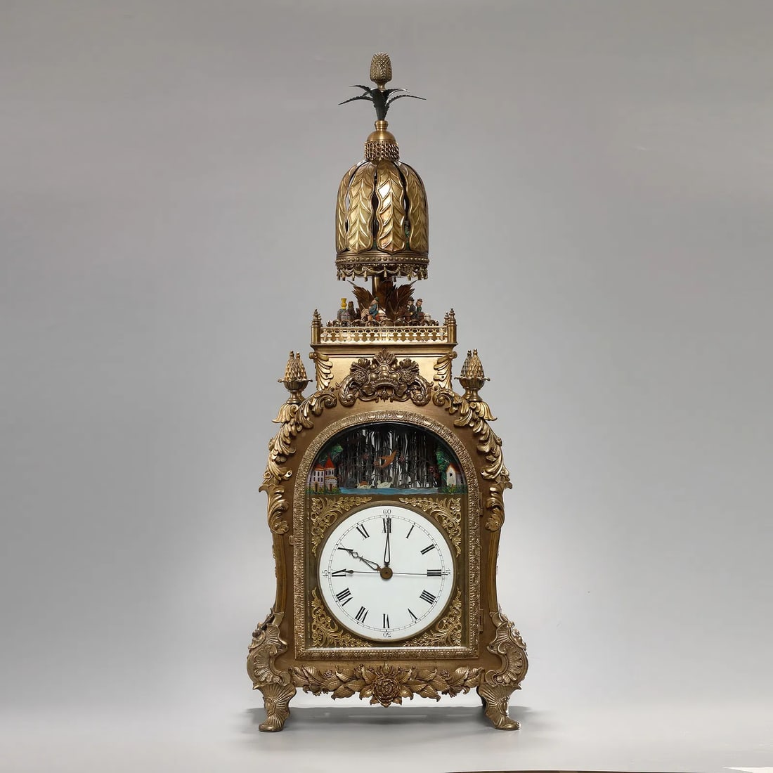 Qing Dynasty Palace Gilded Bronze Palace: Gilded Bronze Palace Automaton Umbrella ClockChinese, Qing DynastyHeight 69 cmDescription: An elaborate gilt bronze automaton table clock in the form of a rotating parasol or umbrella, the dial and mo
