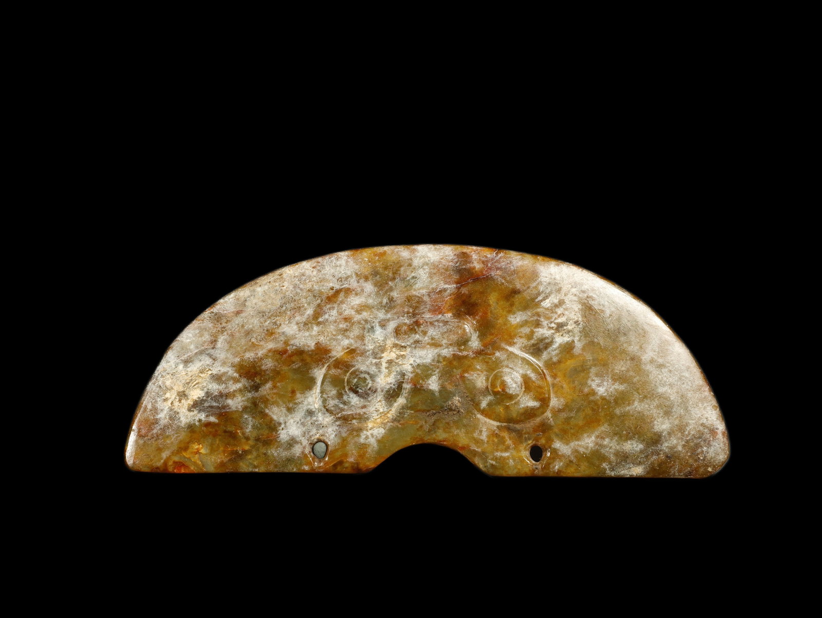 Chinese Liangzhu Culture Pale Celadon Jade Huang: A Pale Celadon Jade Huang Animal Face PendantChina, Liangzhu CultureLength: 5.3 in. (13.5 cm); width 2 in. (5 cm)Description: An arc-form jade huang pendant, the crescent-shaped body of pale celadon t