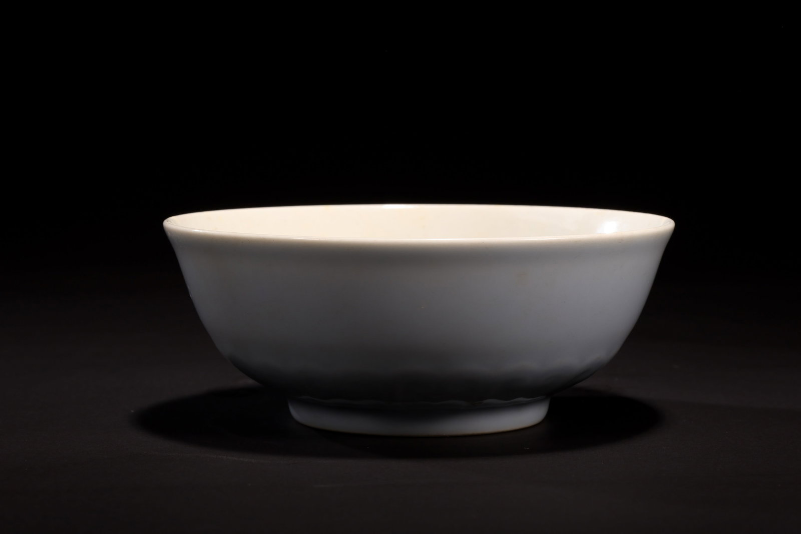 Qing Yongzheng Sky-Blue-Glazed Bowl: Qing Yongzheng Sky-Blue-Glazed BowlQing Dynasty, Yongzheng StyleMouth Diameter: 12.5cm Height: 5cmDescription: A porcelain bowl with rounded sides rising from a low foot to a plain rim, covered overal