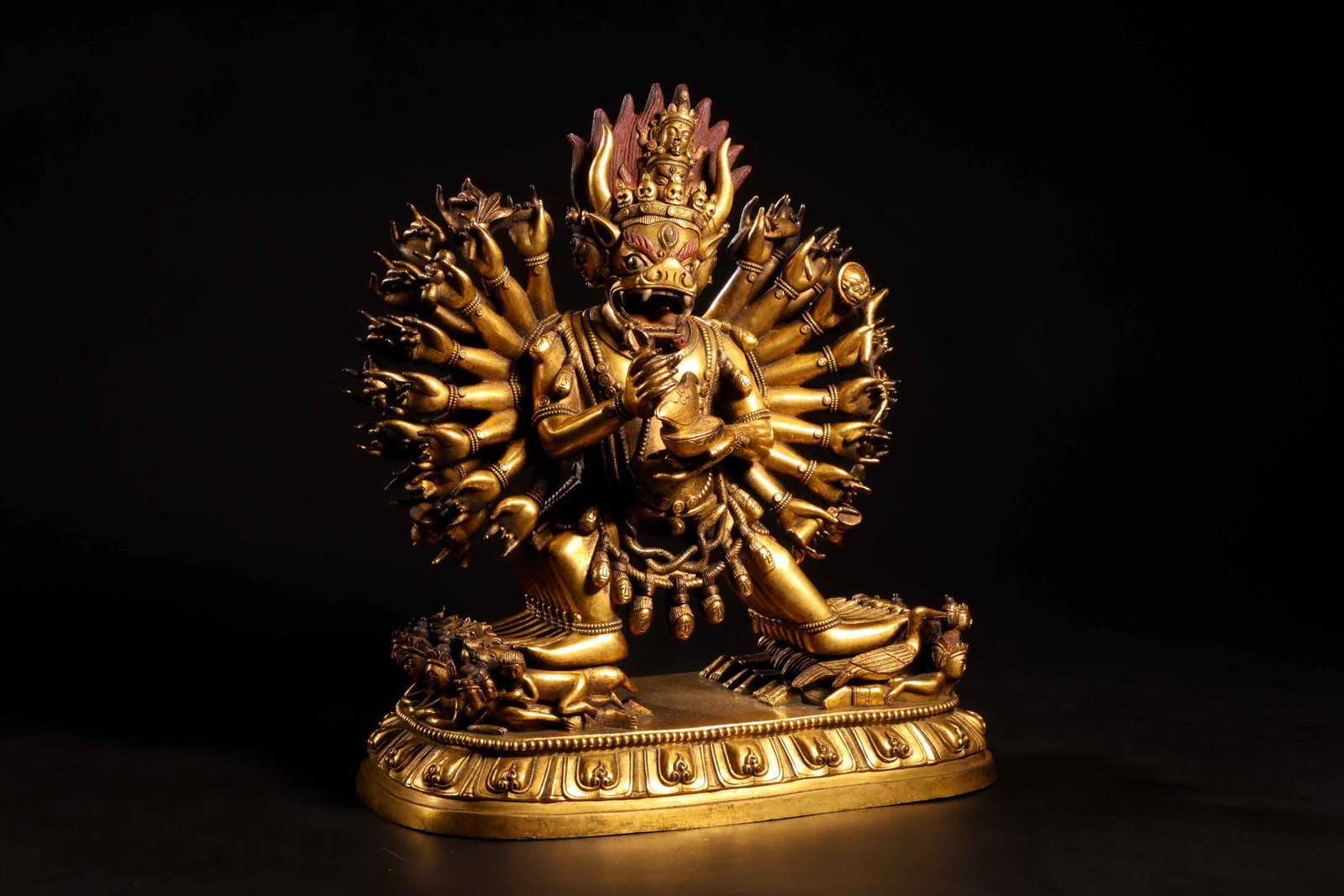 Vajrabhairava (Yamantaka) Multi-Armed Standing: Vajrabhairava (Yamantaka) Multi-Armed Standing FigureSino-Tibetan StyleHeight: 28.5cm Length: 24cm Width: 14.5cmDescription: A gilt-bronze figure of a wrathful, buffalo-headed deity, the bull-horned h