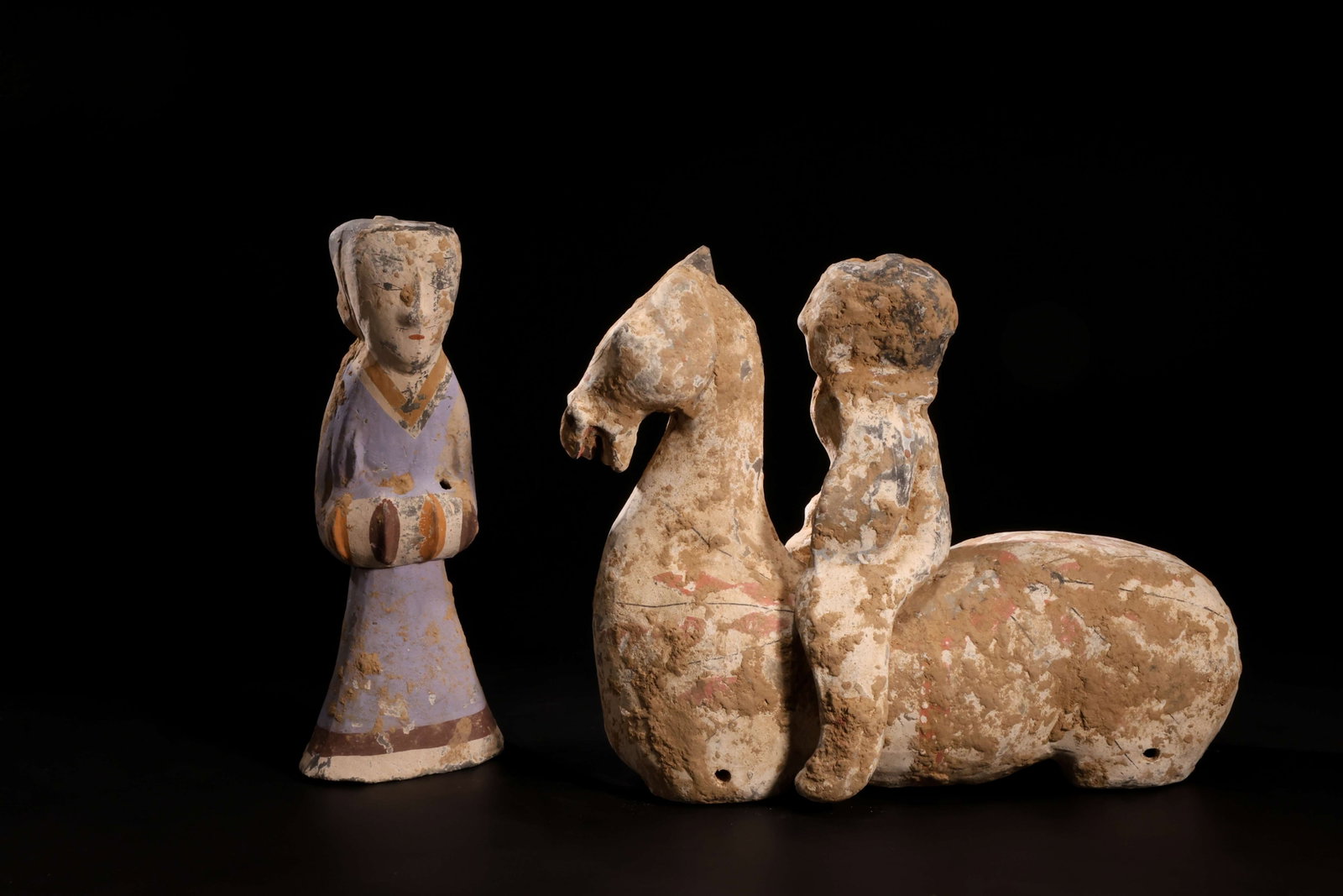 Han DynastyRed-and-Green Painted Pottery Court Lady on Horseback Figurine (Pair): Han Dynasty Red-and-Green Painted Pottery Court Lady on Horseback FigurineHan Dynasty (206 BC-220 AD)Height: 26cm Horse: Height: 25cm Length: 30cmDescription: A group of two painted pottery figures: a