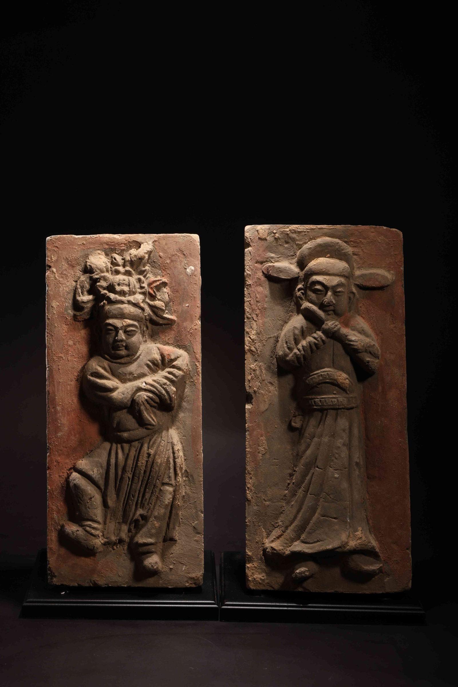 Tang Dynasty Musician-Figure Pottery Brick: Tang Dynasty Musician-Figure Pottery BrickTang Dynasty (618-907 AD)Height: 38cm Width: 16cm Depth: 2.5cmDescription: A pair of rectangular pottery tomb bricks, each molded in high relief with a standi